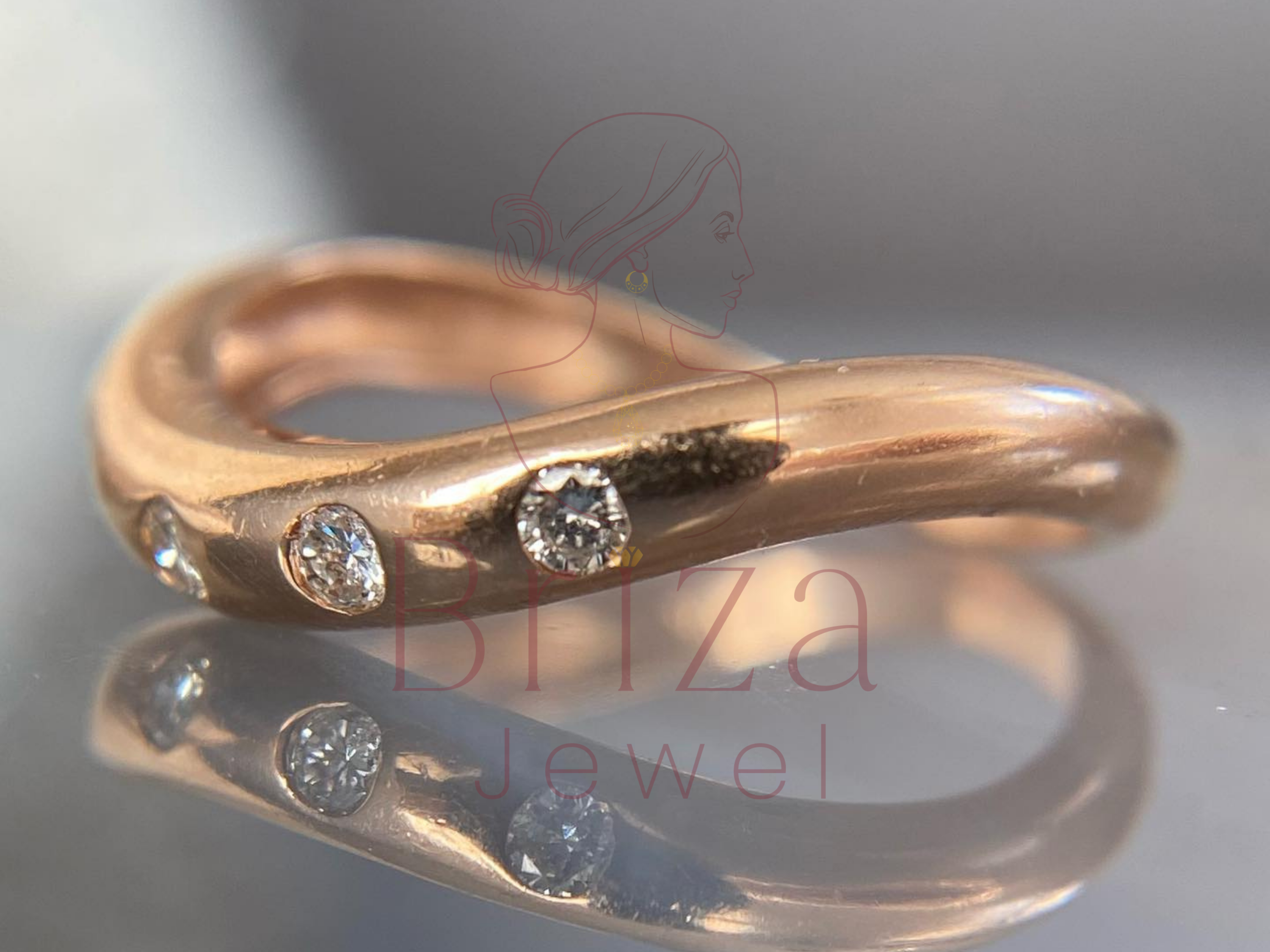 curved rose gold band with pavé stone accents