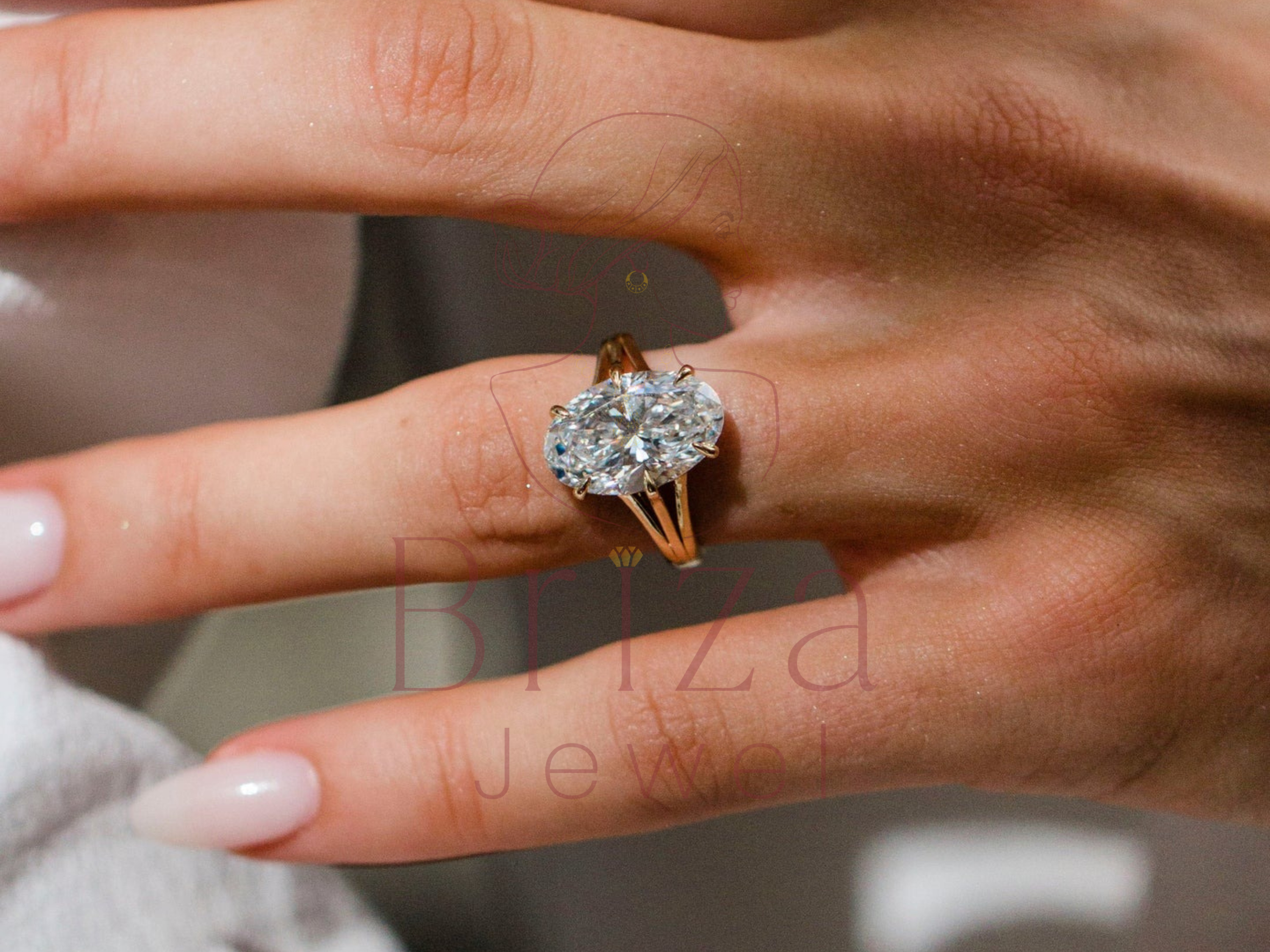 Close-up of a hand wearing a diamond ring with a blurred background