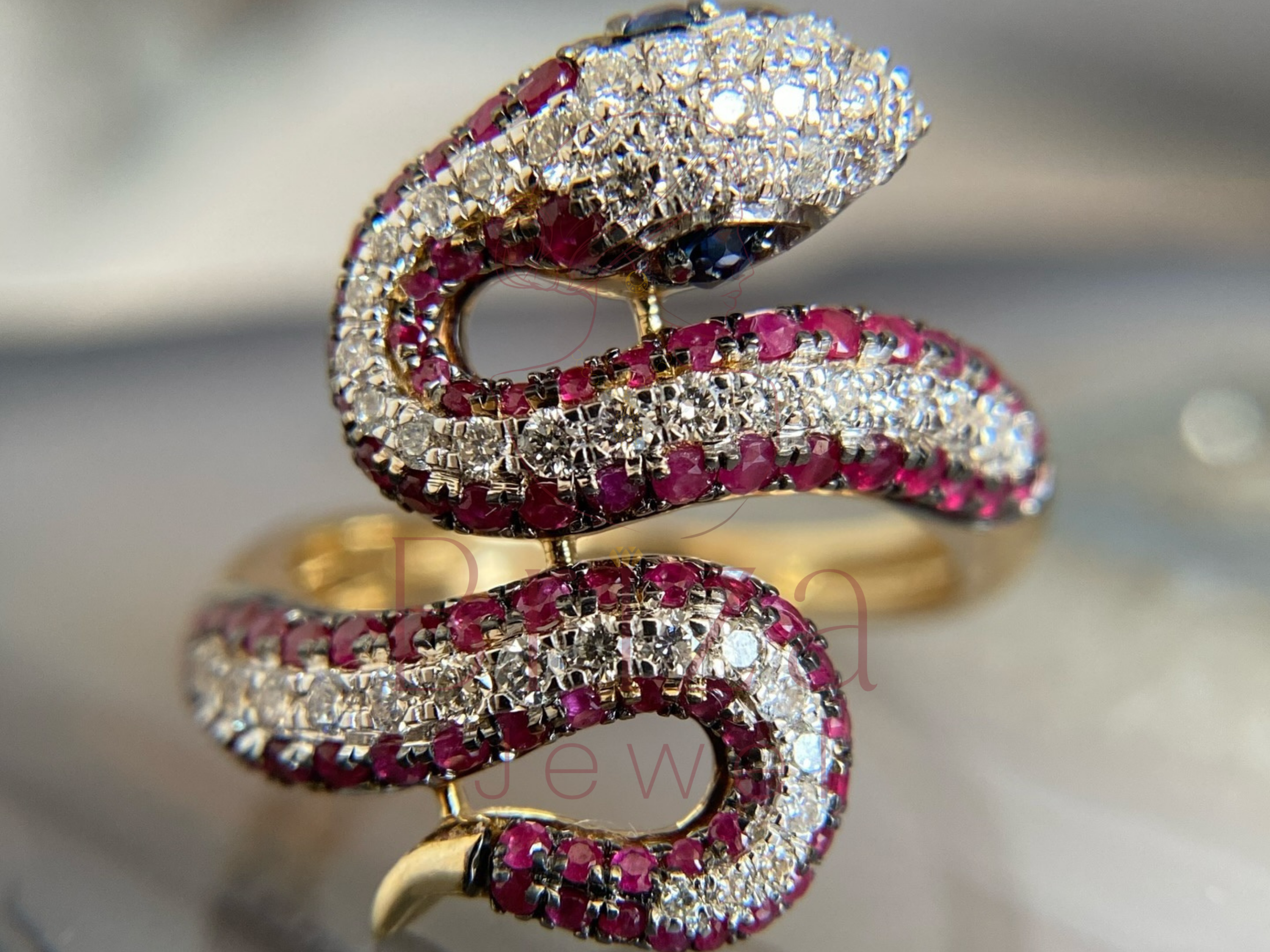 side view of sculpted gold design with gemstone accents