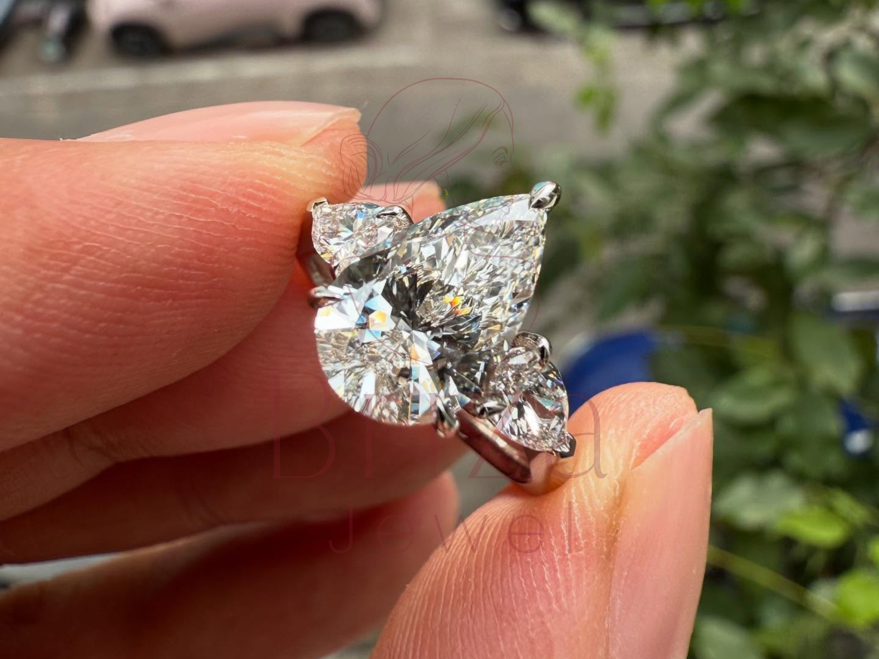 lab grown diamond engagement ring with pear three stone design