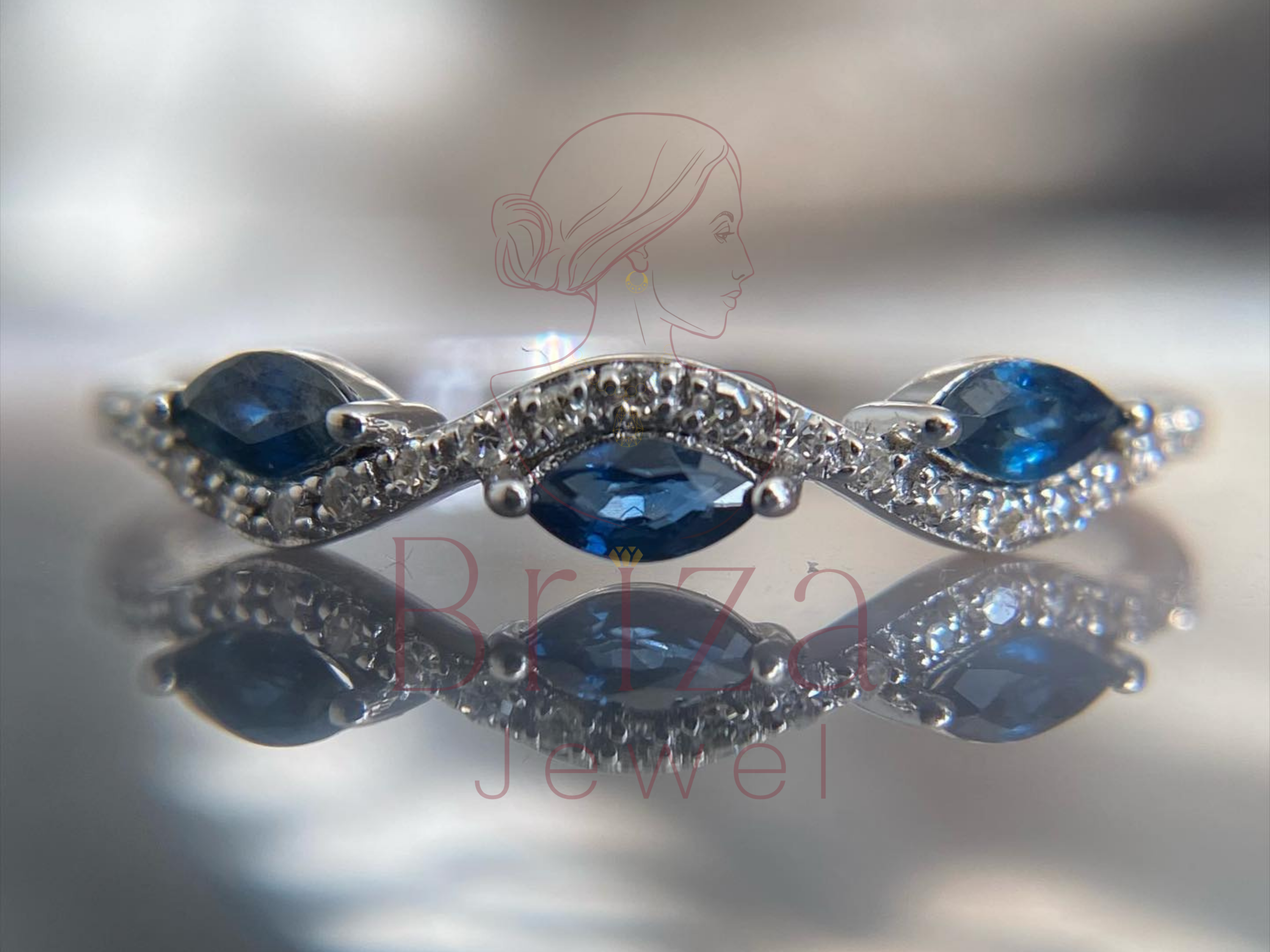 blue sapphire marquise ring with white gold diamond bands