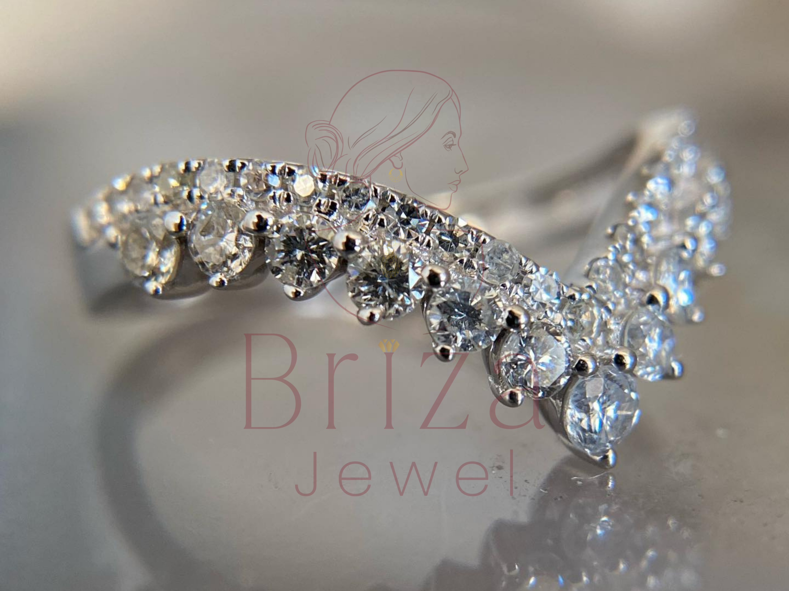 curved white gold band with pavé diamond accents