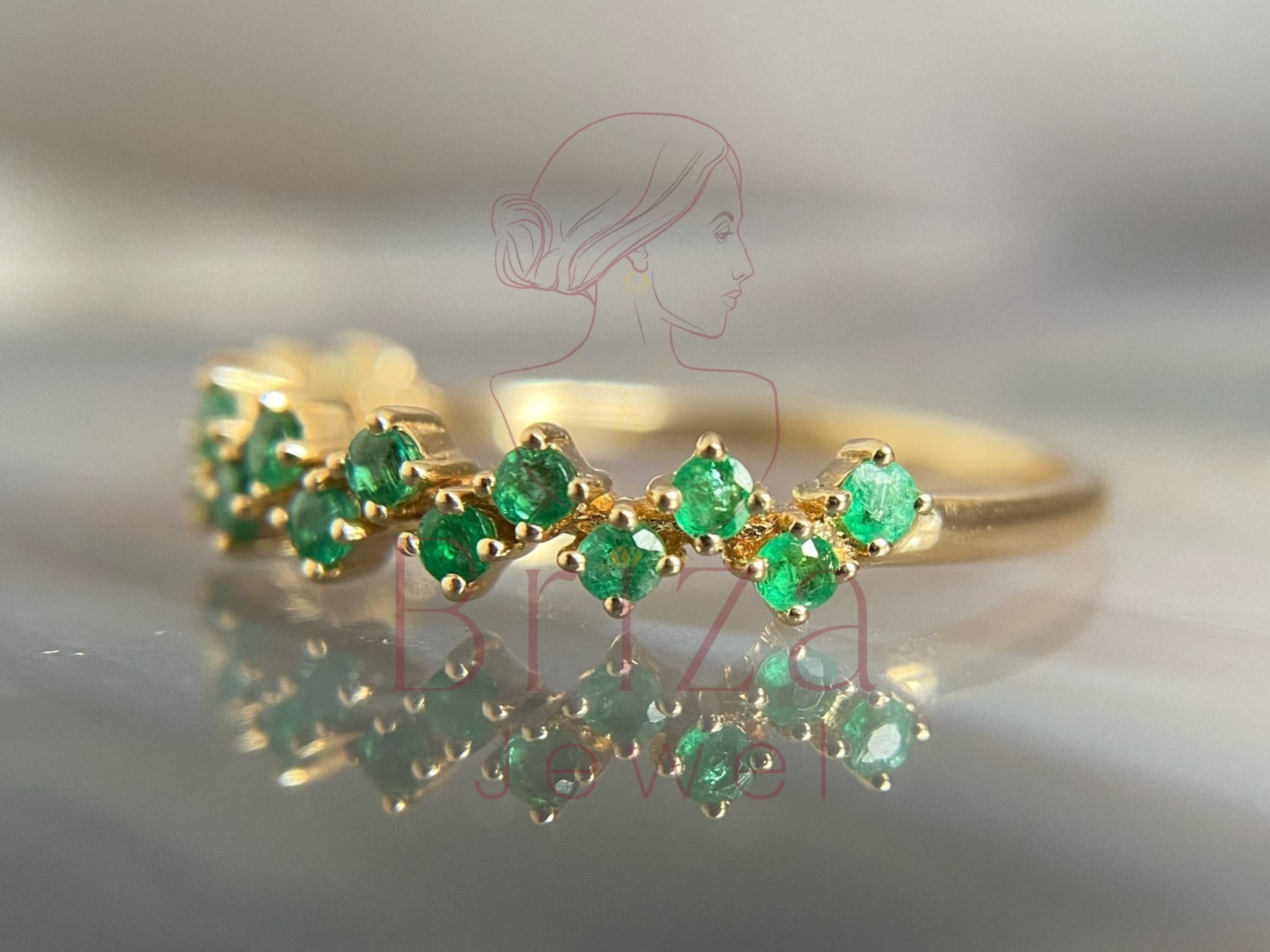 gold stacking band with clustered green gemstones