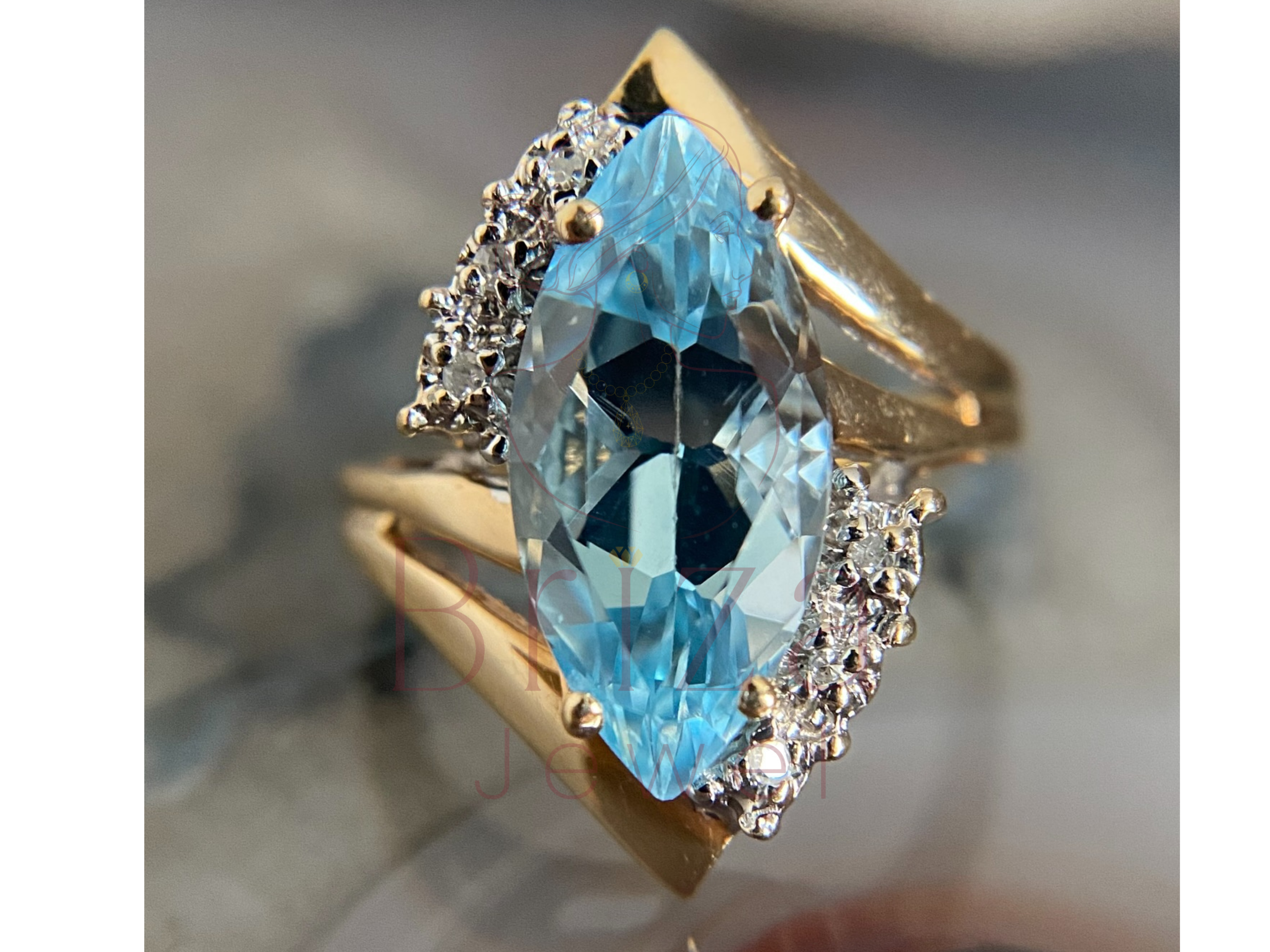 marquise engagement ring with blue moissanite center stone