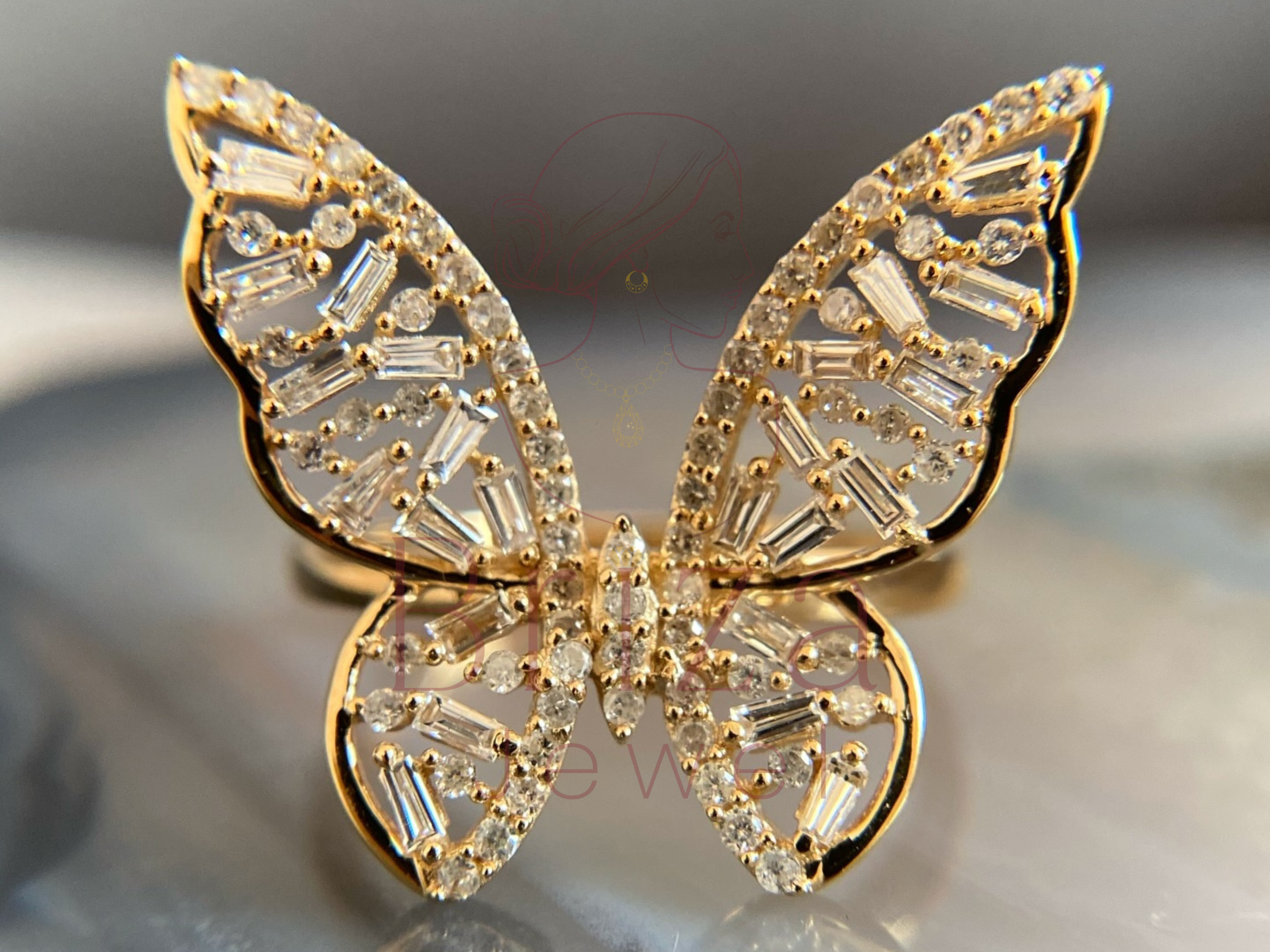 butterfly engagement ring with baguette and round diamonds