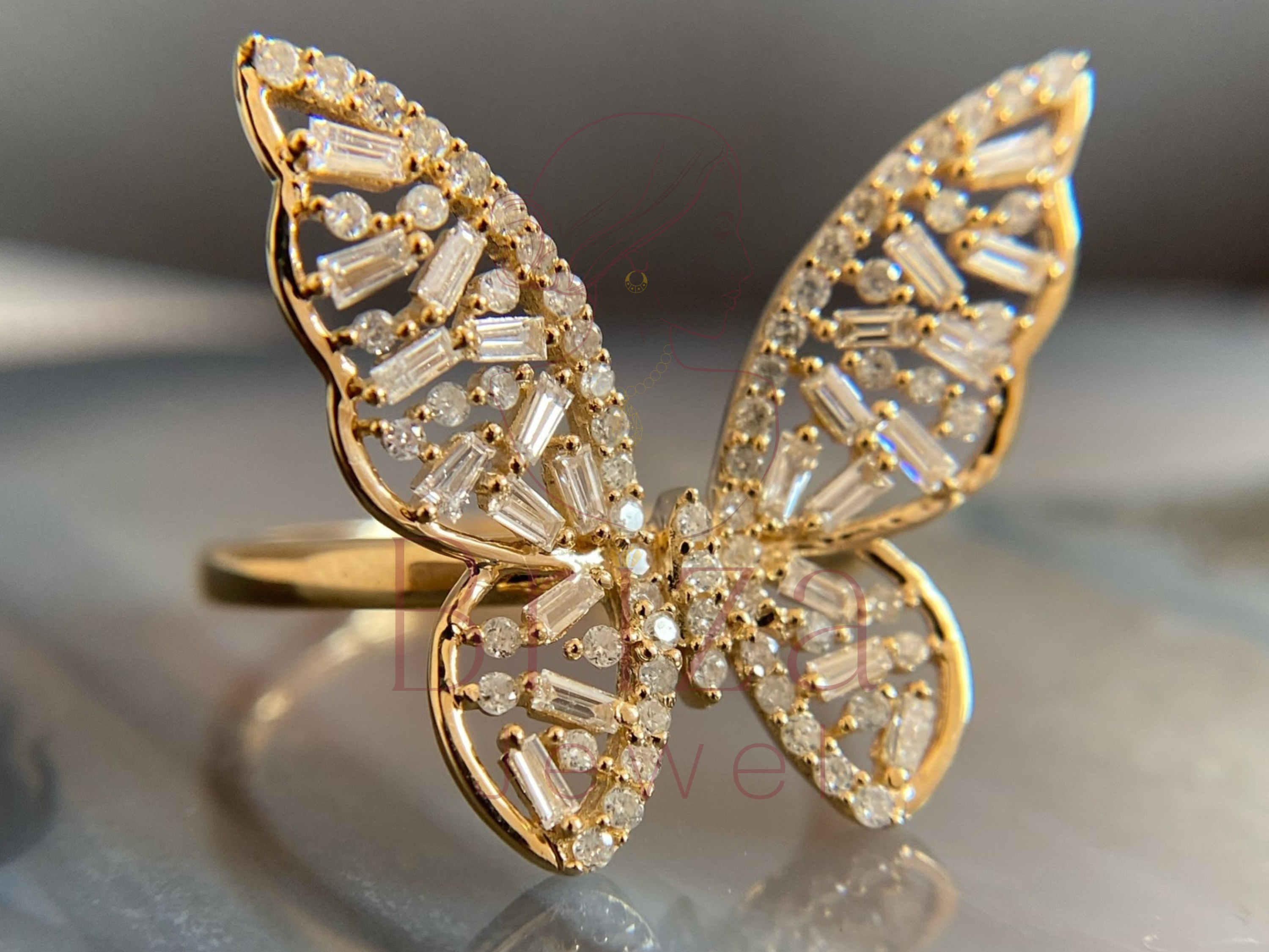 side view of butterfly motif diamond ring in gold