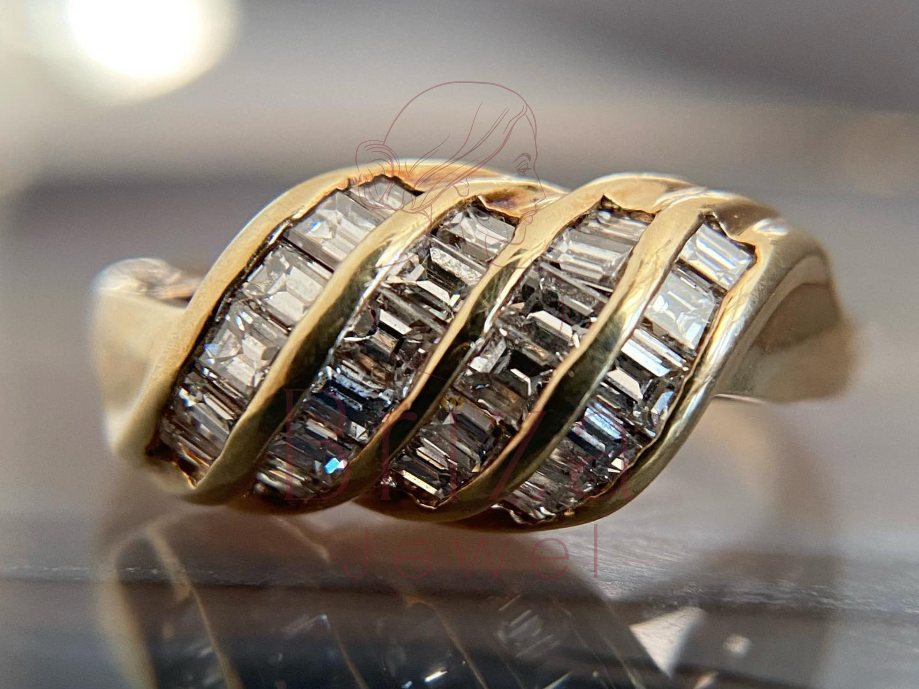 gold cocktail ring with 18K baguette diamond wave design