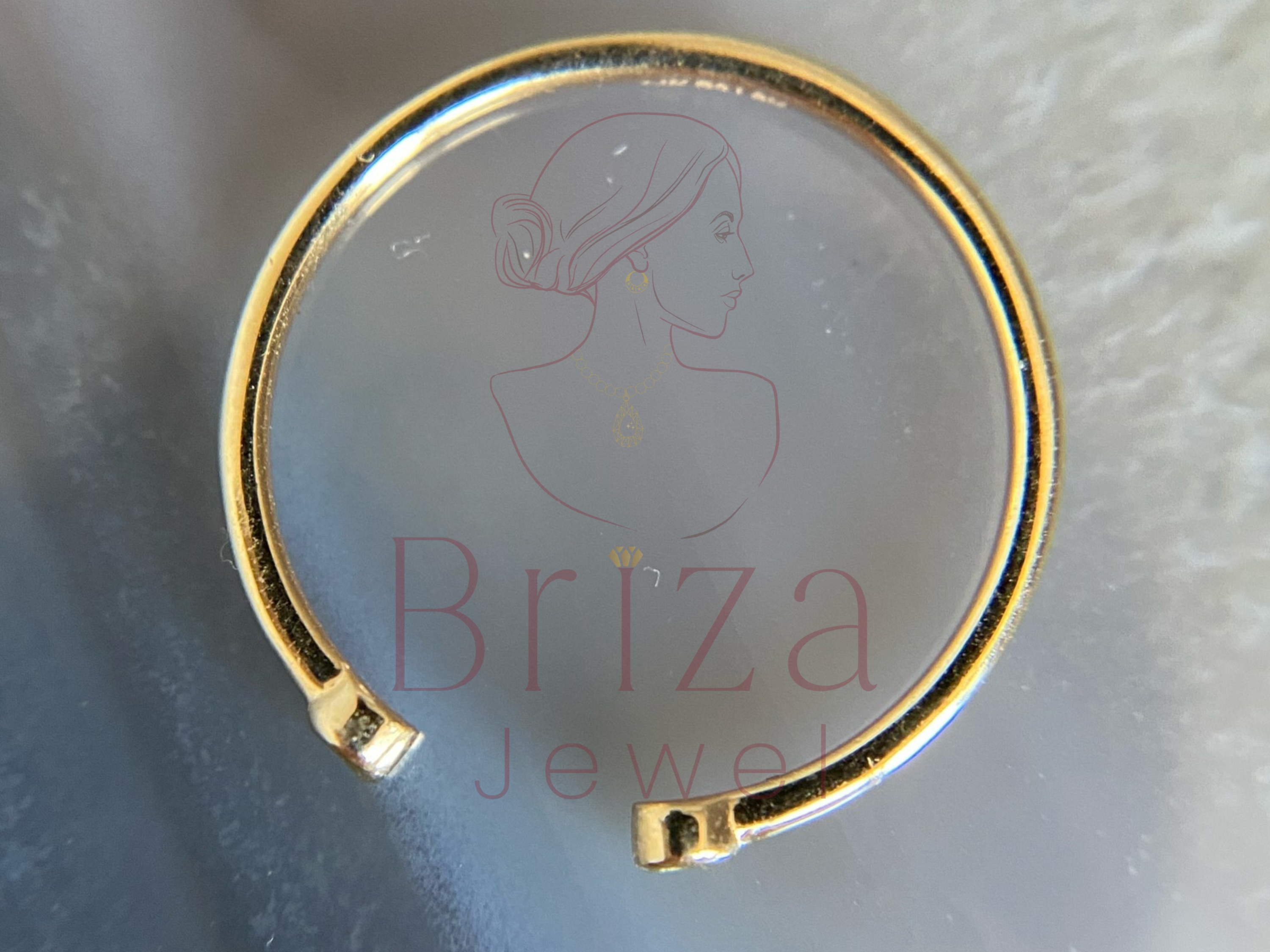 side view of open gold design with small diamond detail