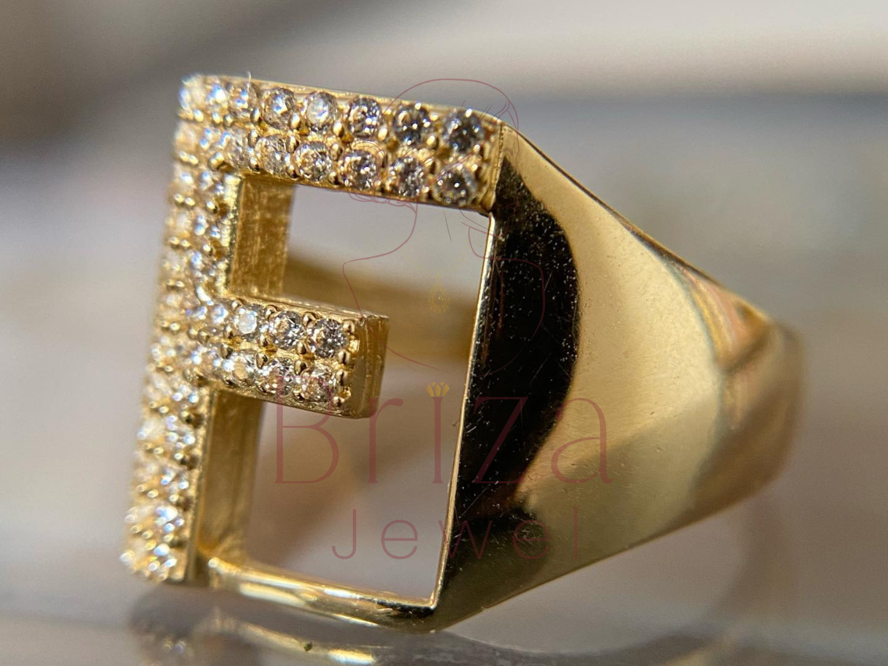 statement diamond letter jewelry worn on hand lifestyle view