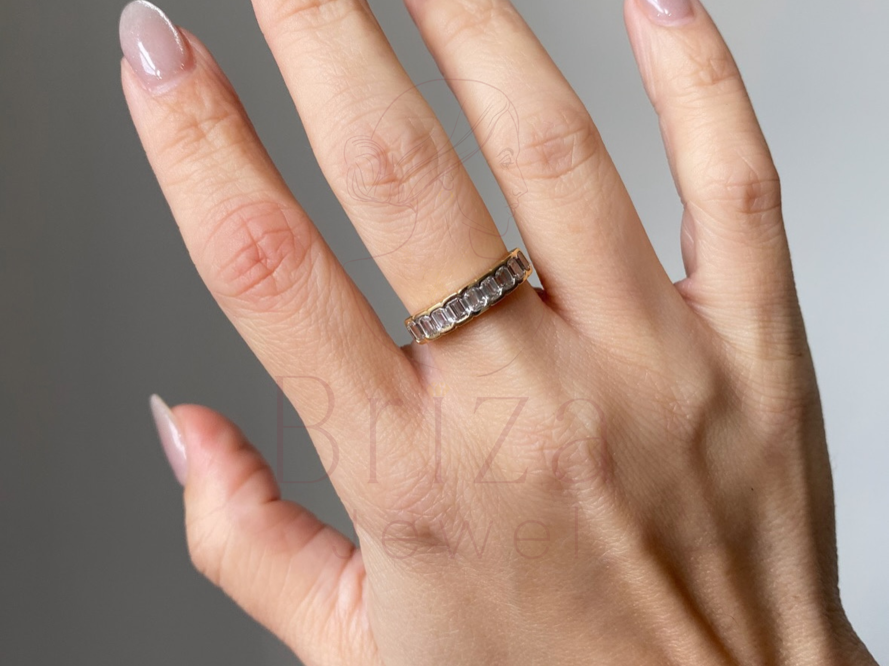 luxury gemstone eternity band worn on hand lifestyle view