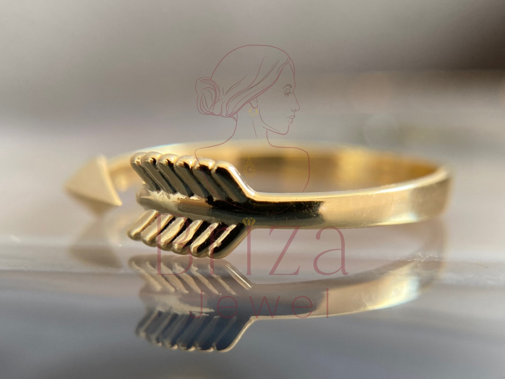 dainty gold wrap design with arrow-inspired shape