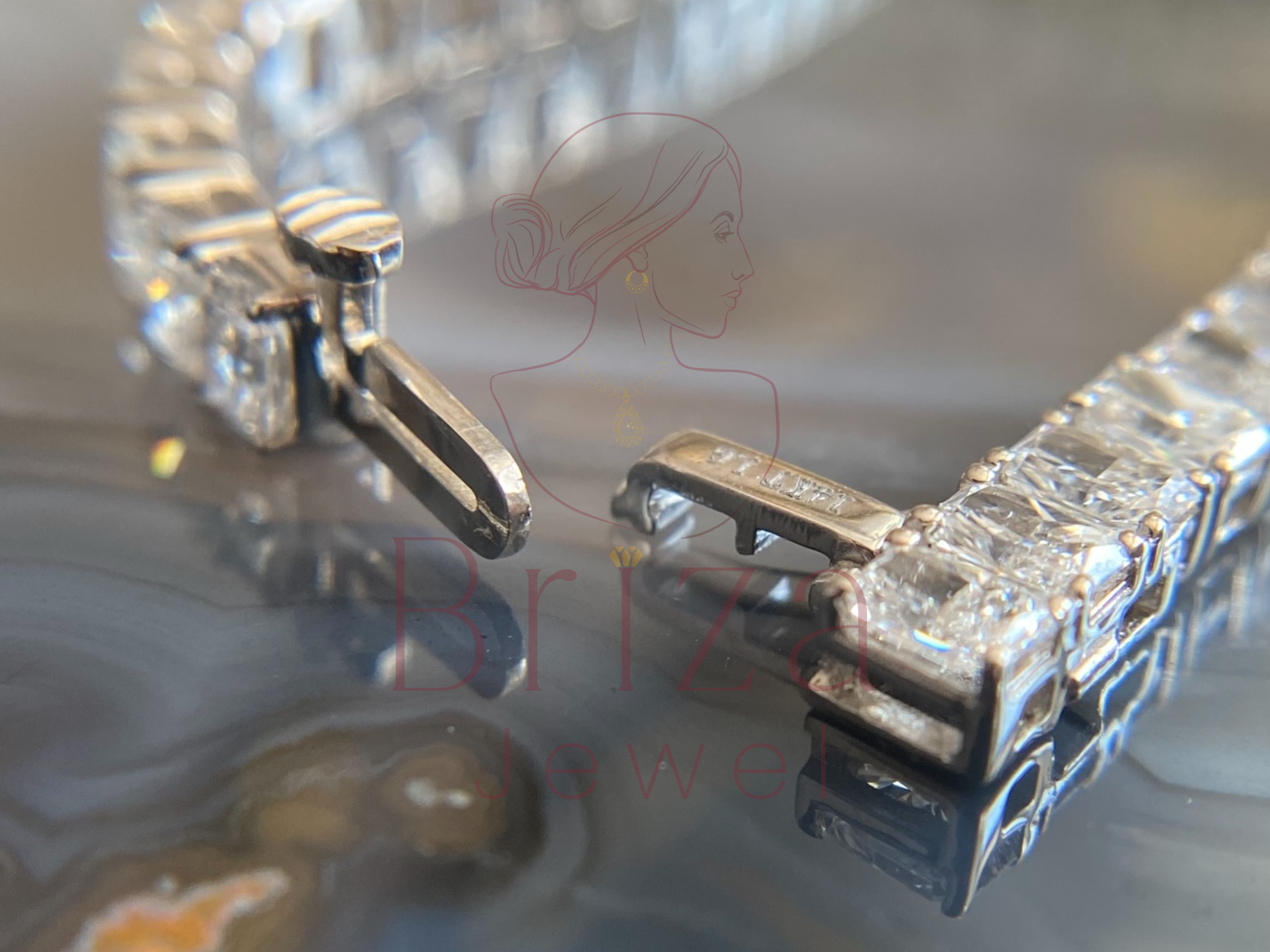 Close-up of a diamond earring on a reflective surface with 'Israfil' branding.