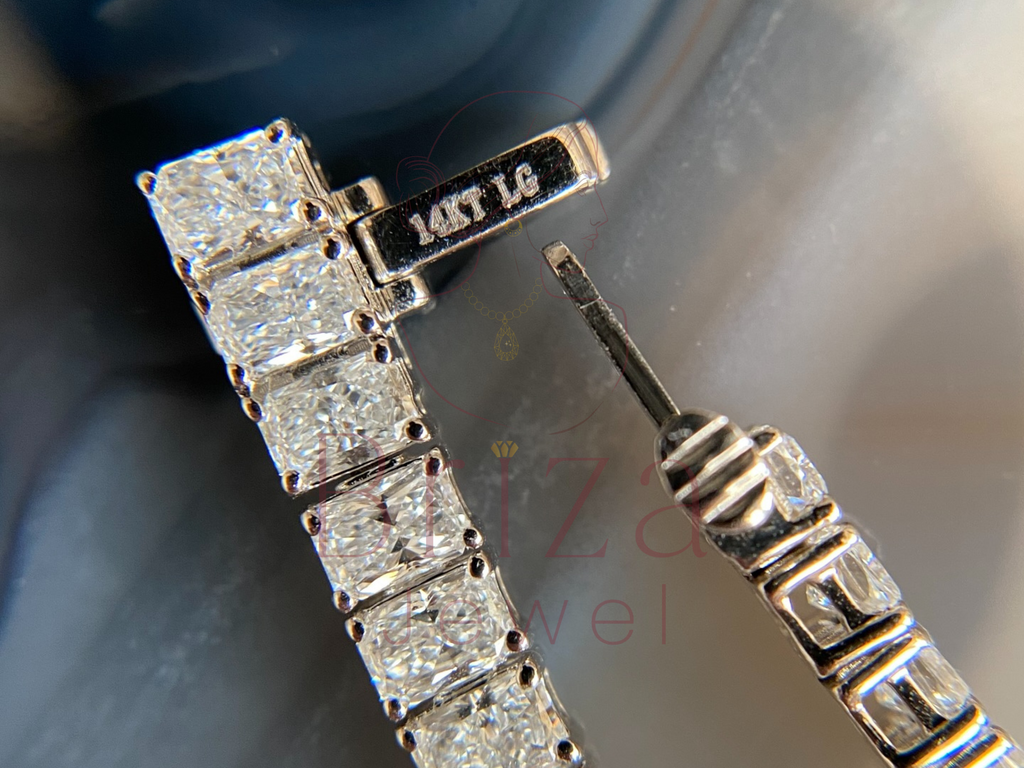Close-up of diamond earrings with a blurred background