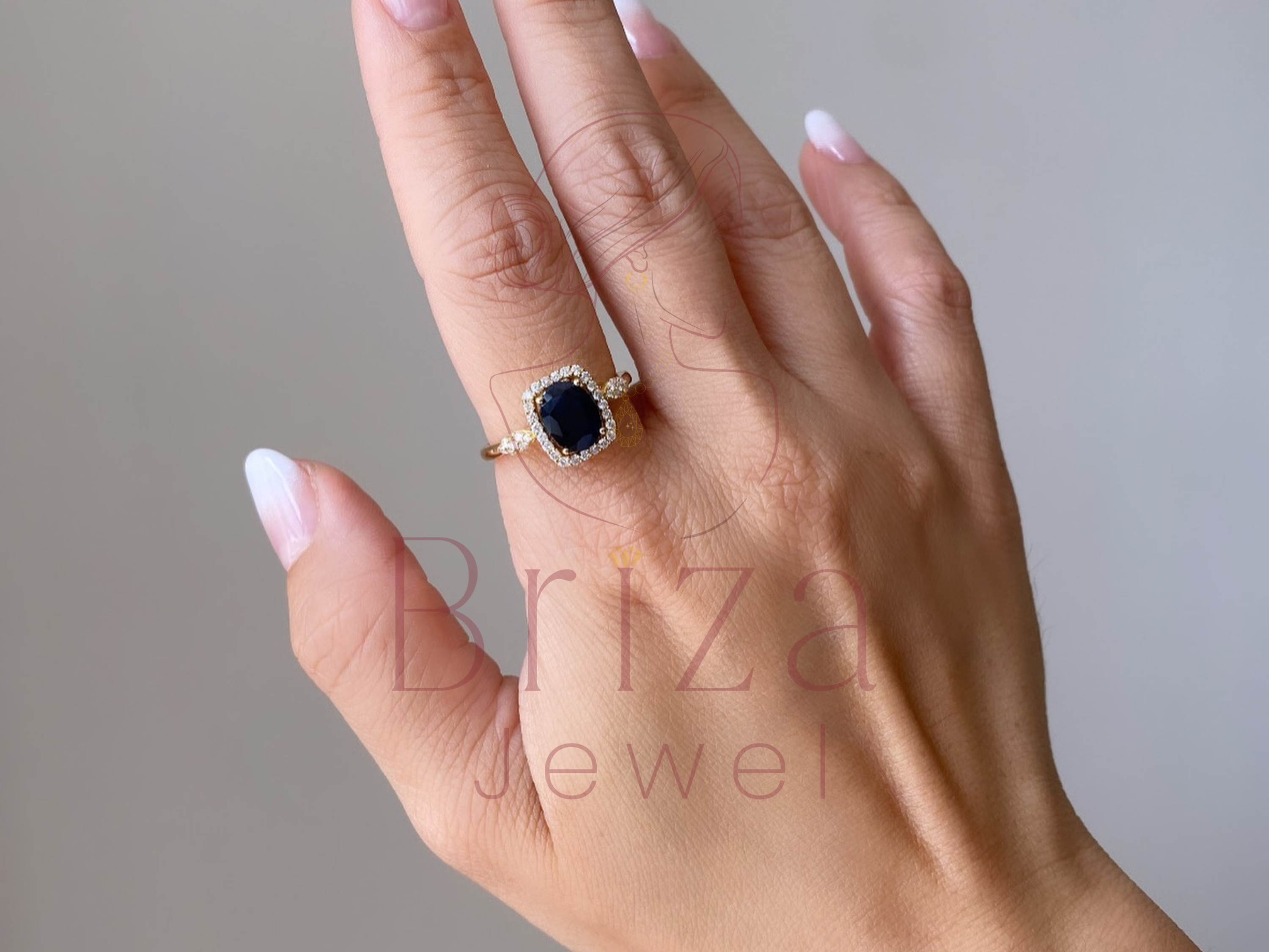 blue sapphire wedding band close-up showing halo setting