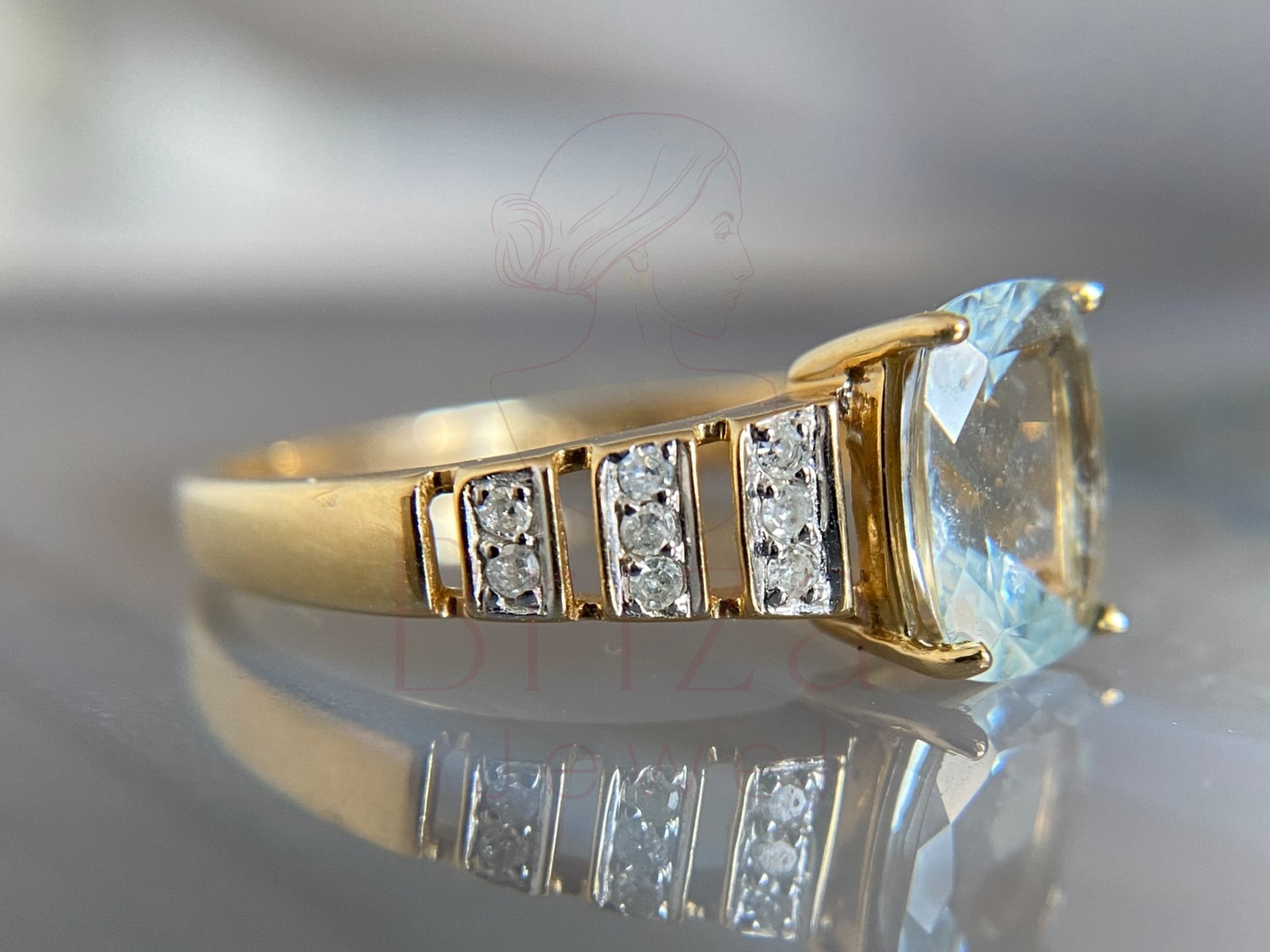 side view of art deco gold ring with aquamarine detail