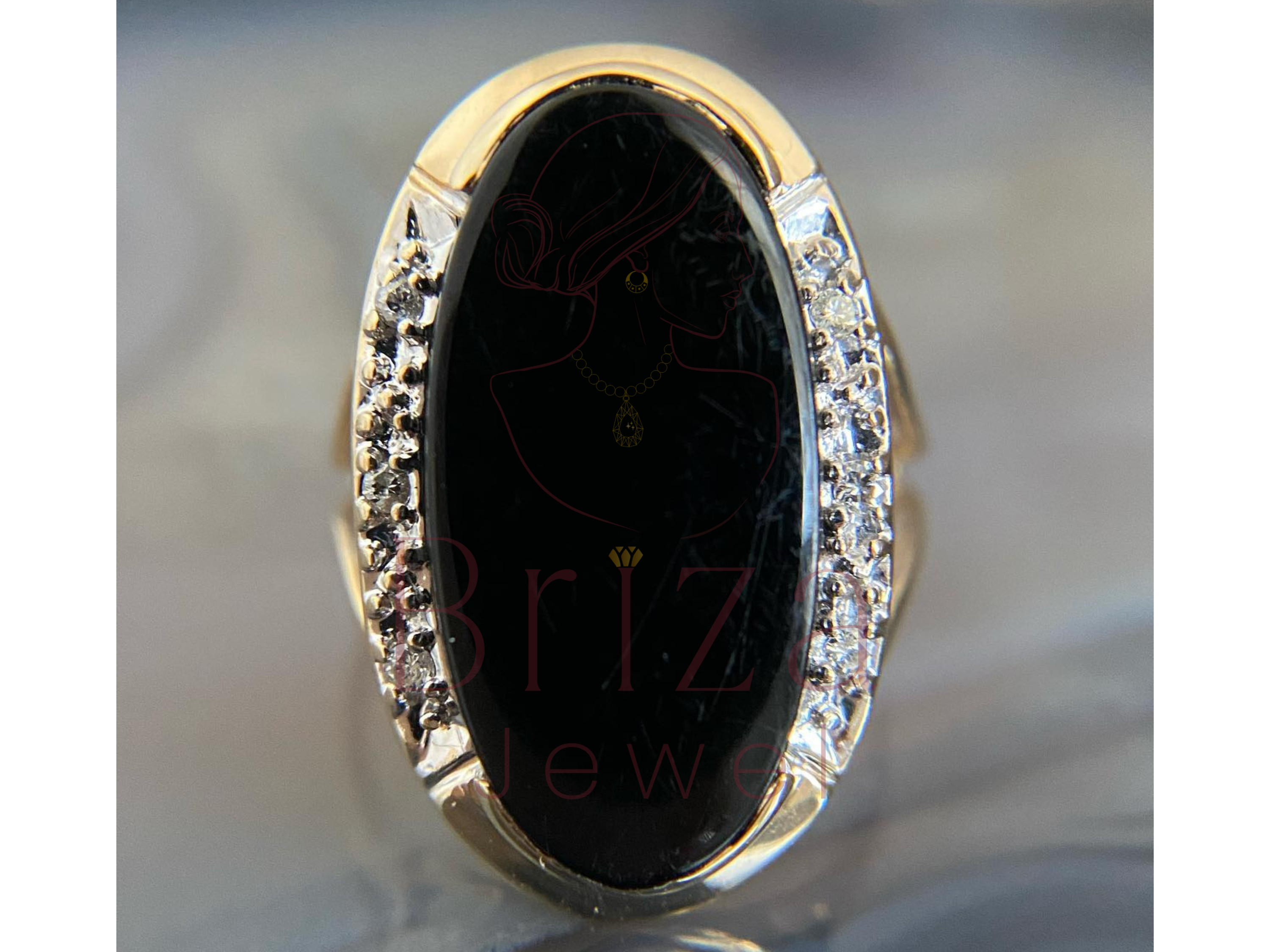 women’s black wedding ring with oval black gemstone and diamond accents