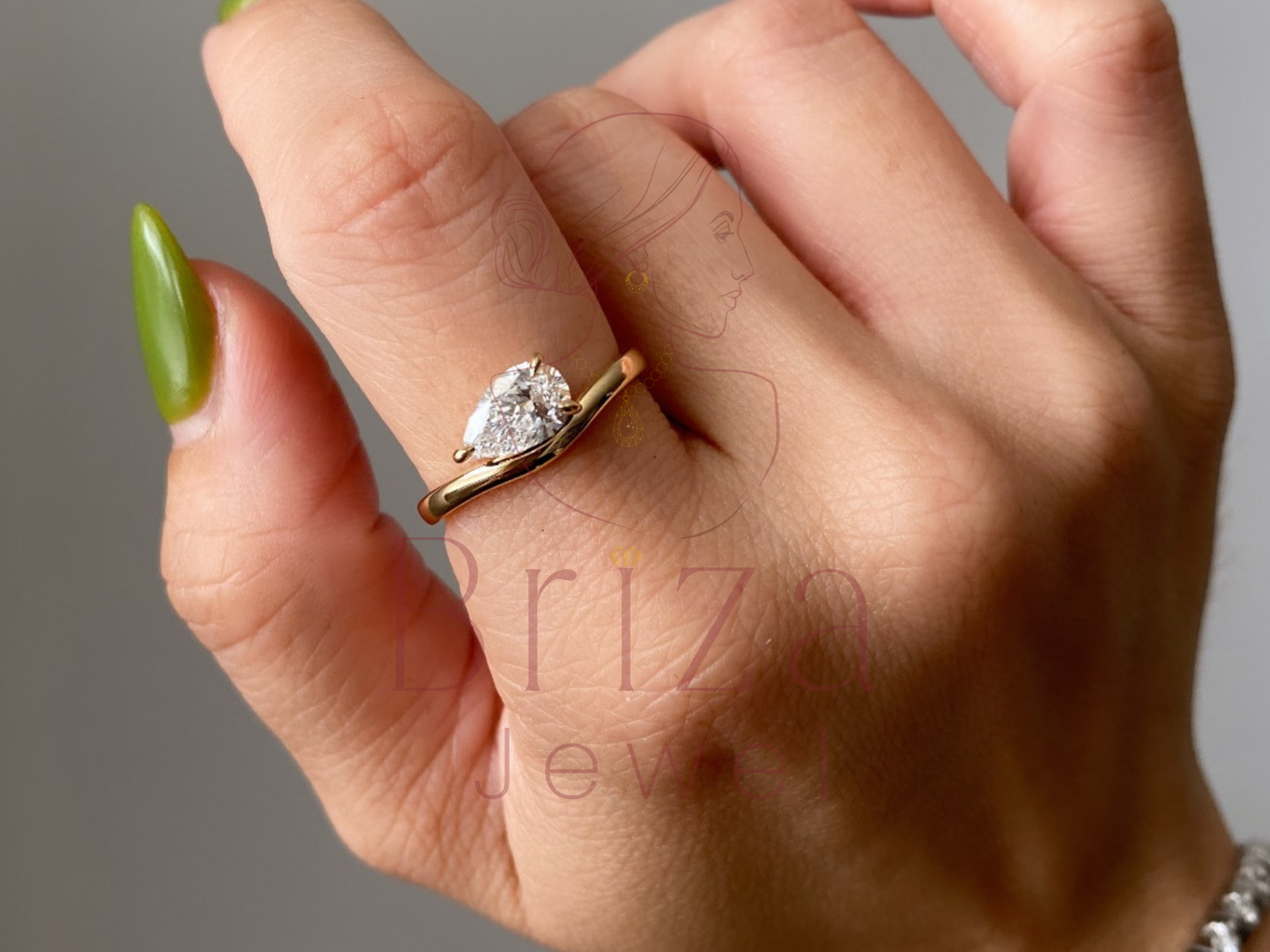 pear engagement ring close-up showing teardrop center stone