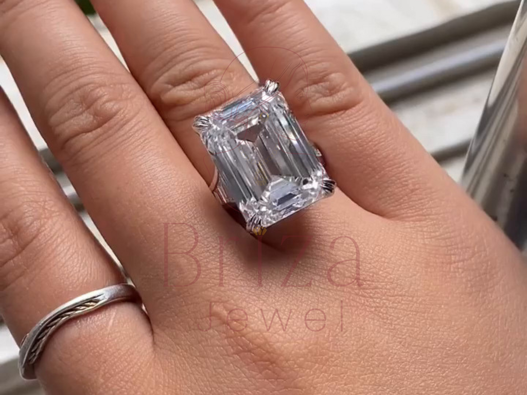 emerald-shaped center stone ring with baguette side accents