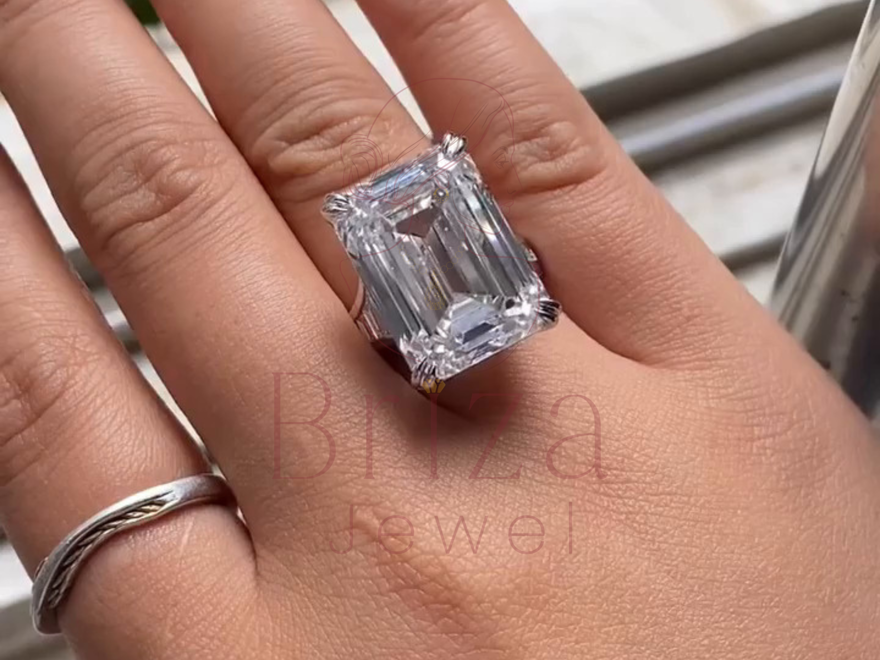 emerald-shaped center stone ring with baguette side accents