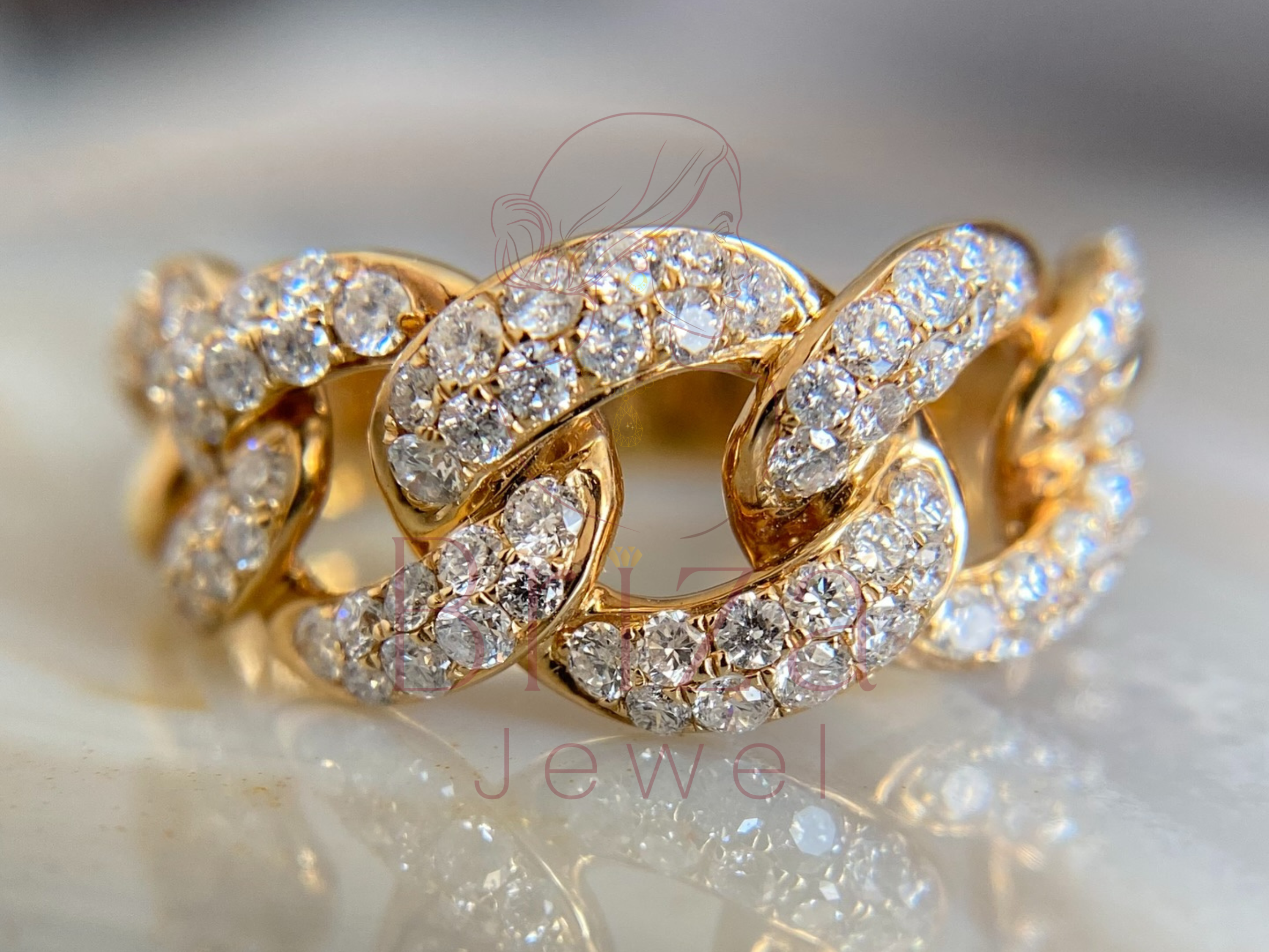 cuban ring close-up showing pavé diamond links