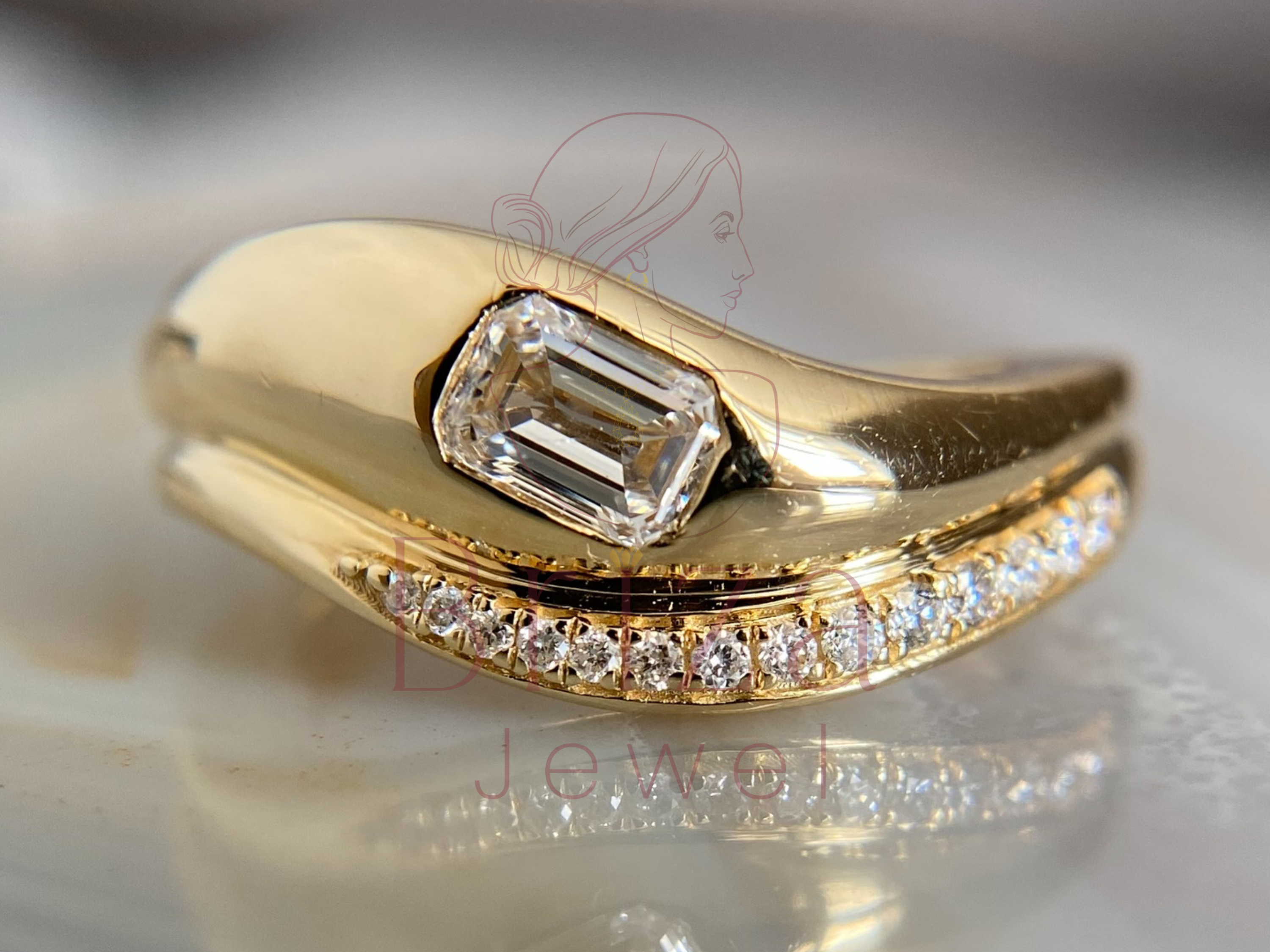 yellow gold emerald cut engagement ring with pavé accent band