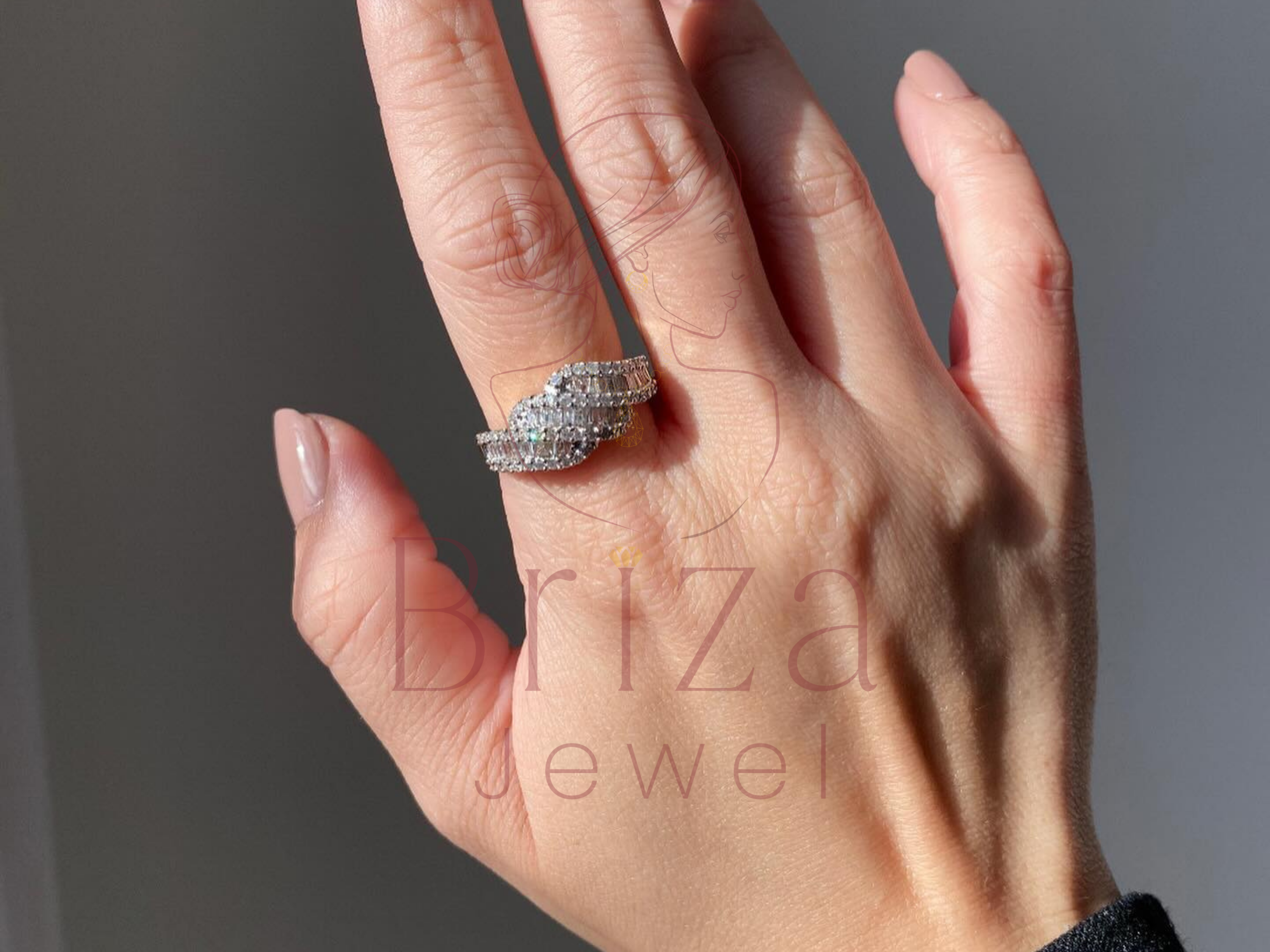 religious cross motif ring with baguette stone wave band