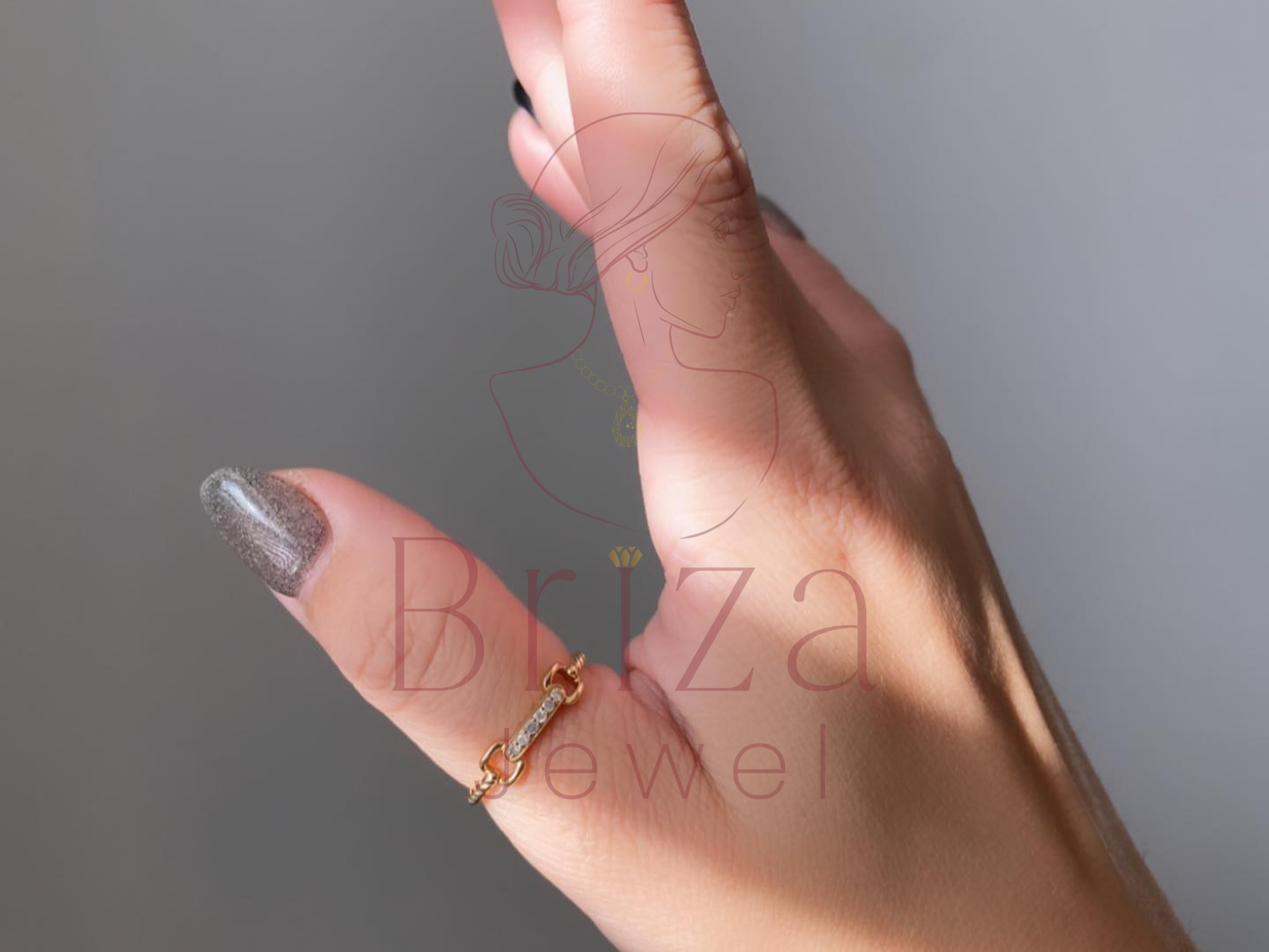 gold chain-inspired jewelry with subtle diamond highlights