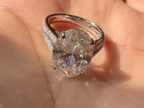 Silver ring with a large diamond on a hand