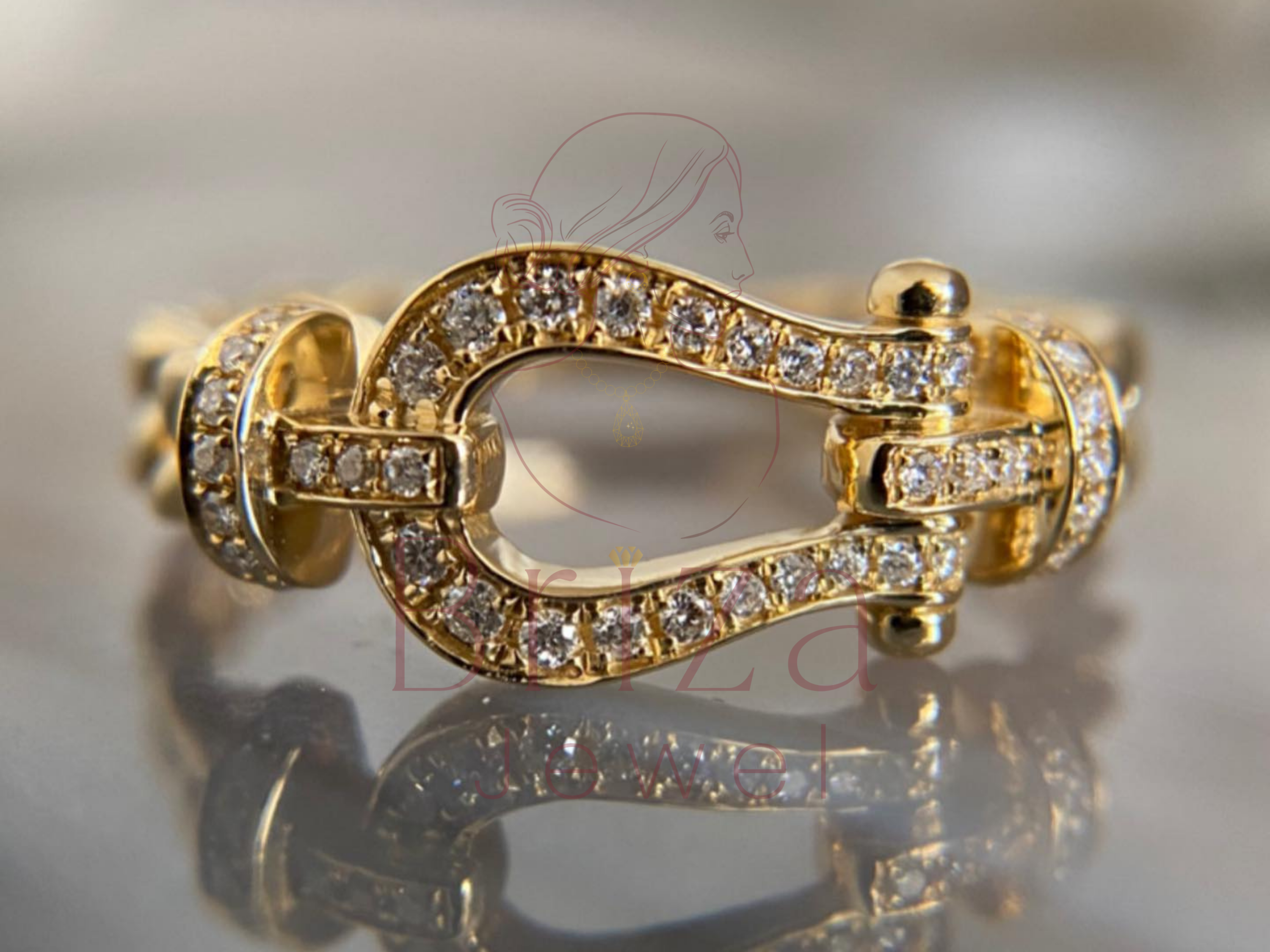 yellow gold engagement band with diamond pavé buckle design in 14k