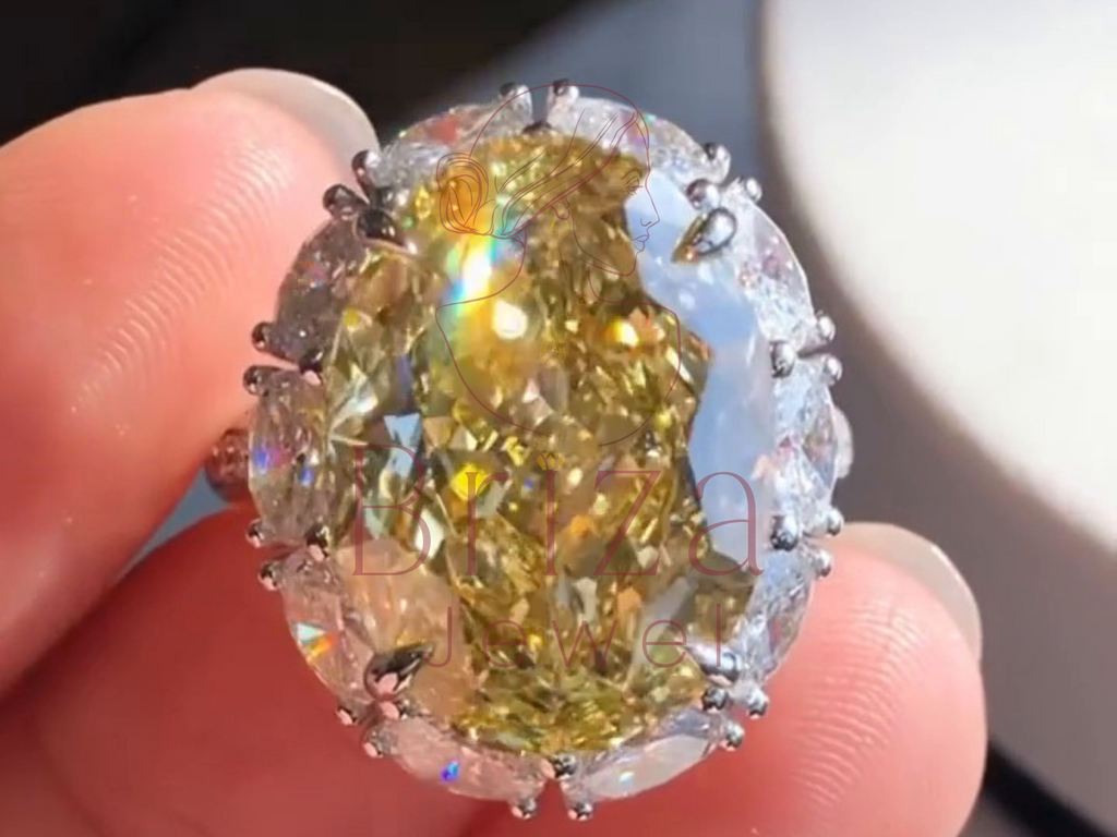 Close-up of a large, colorful diamond held between fingers.