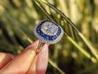 Cushion Cut Halo Engagement Ring with Blue Sapphire Accents