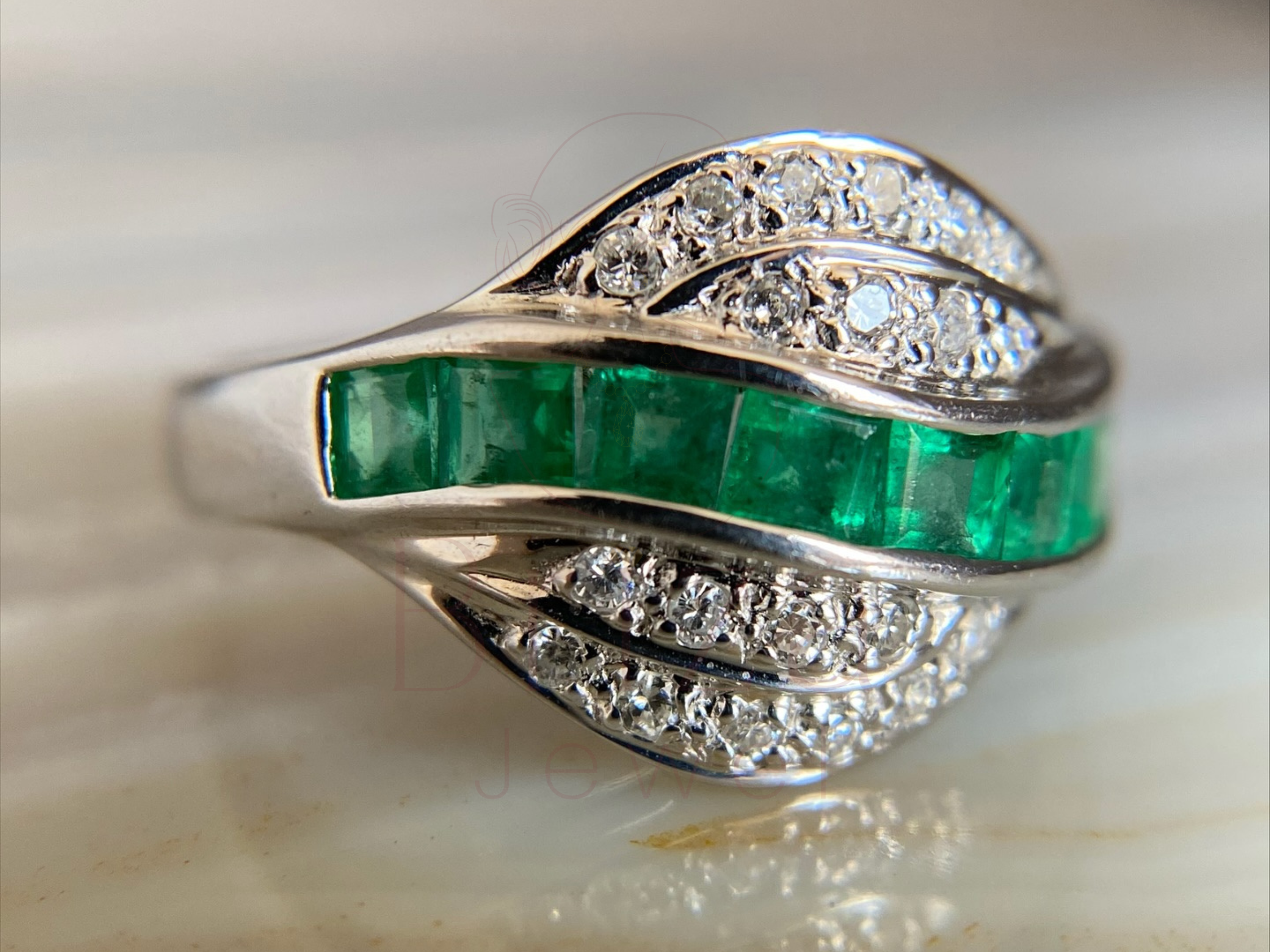 vintage white gold ring with emerald center stone