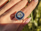 Cushion Cut Halo Engagement Ring with Blue Sapphire Accents