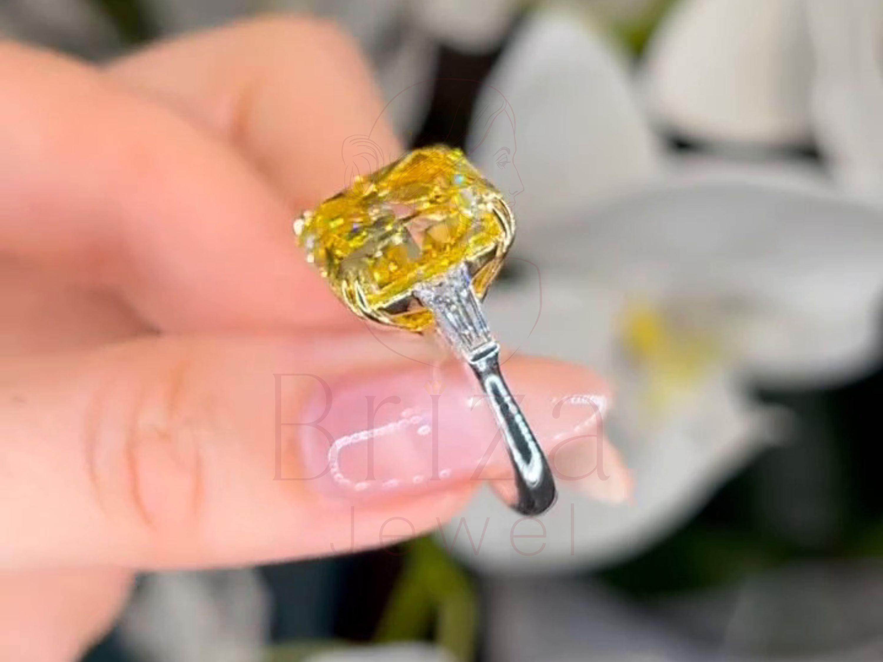 Fancy engagement ring detail with center gemstone