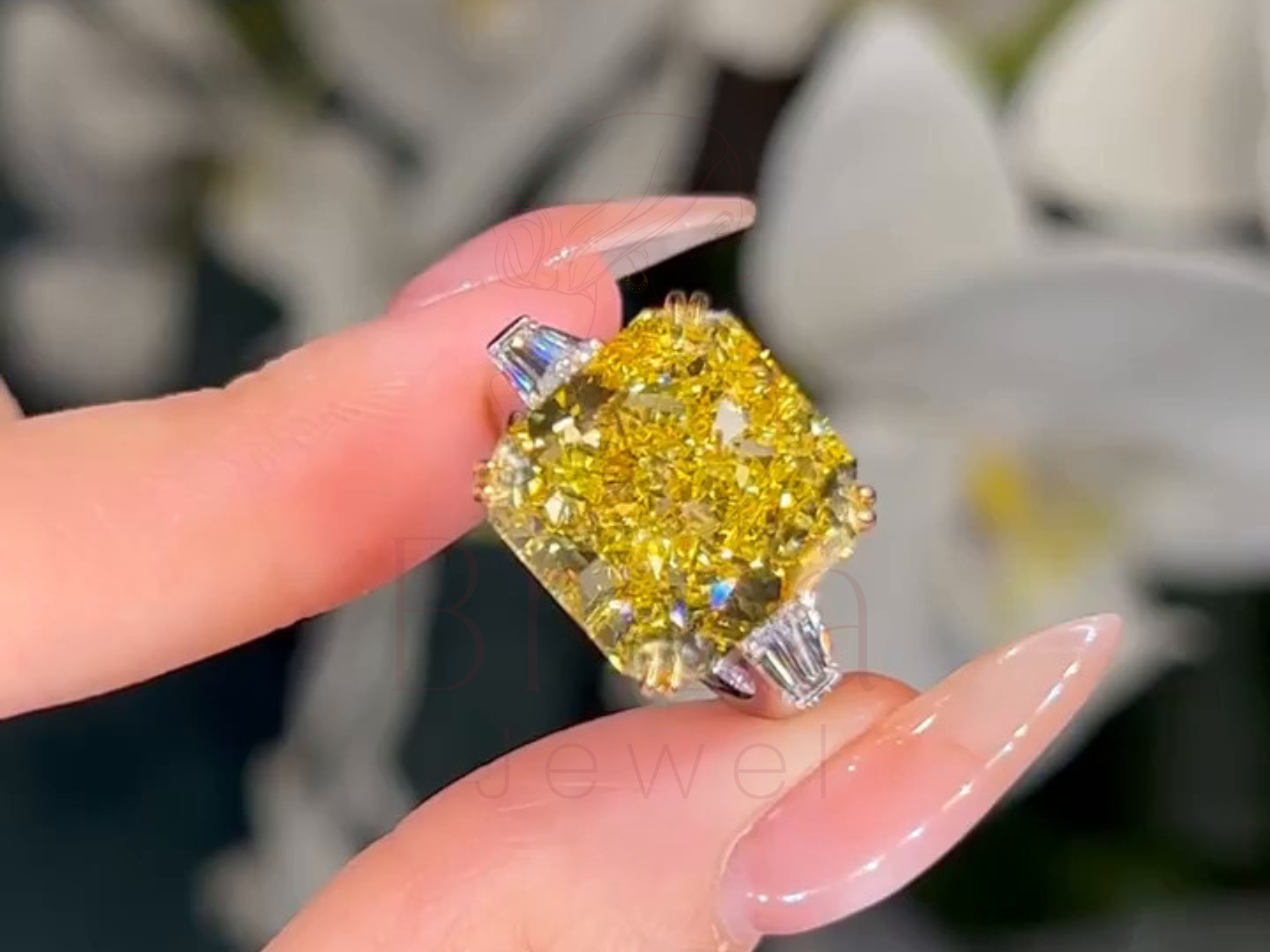 Luxury ring held by a hand with blurred background