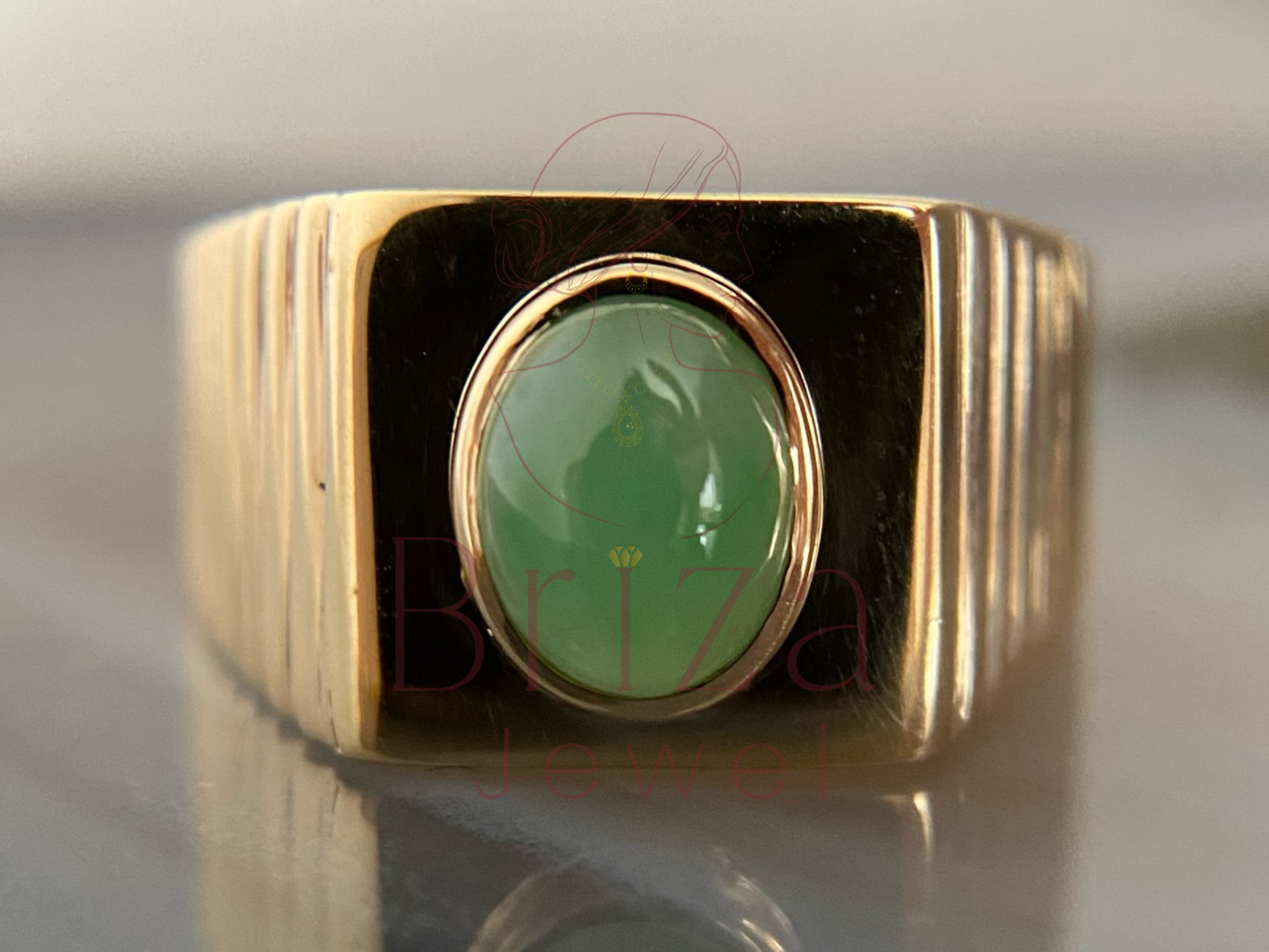 green jade ring with vintage gold signet design