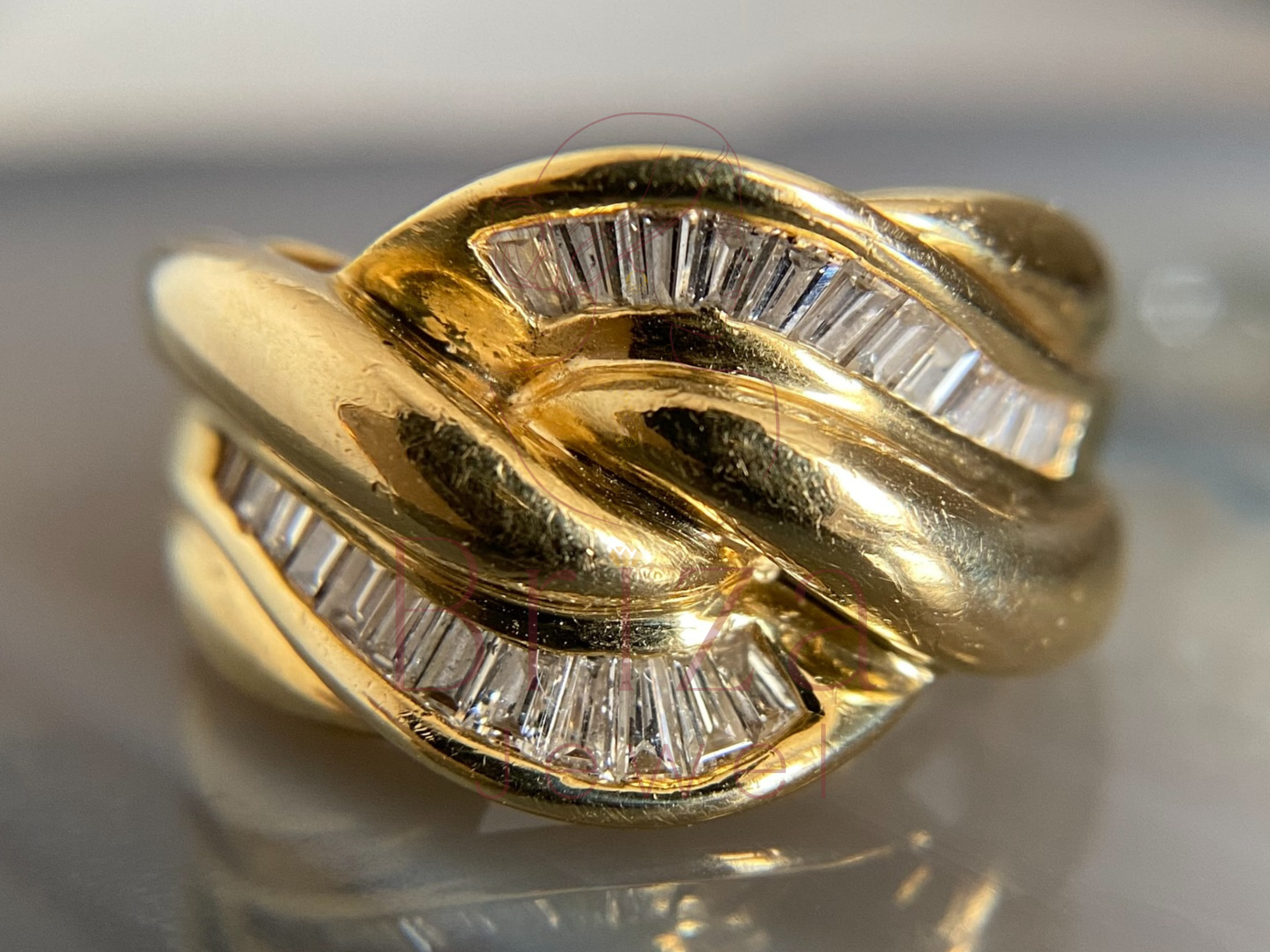 vintage gold dome ring close-up showing baguette diamond detail