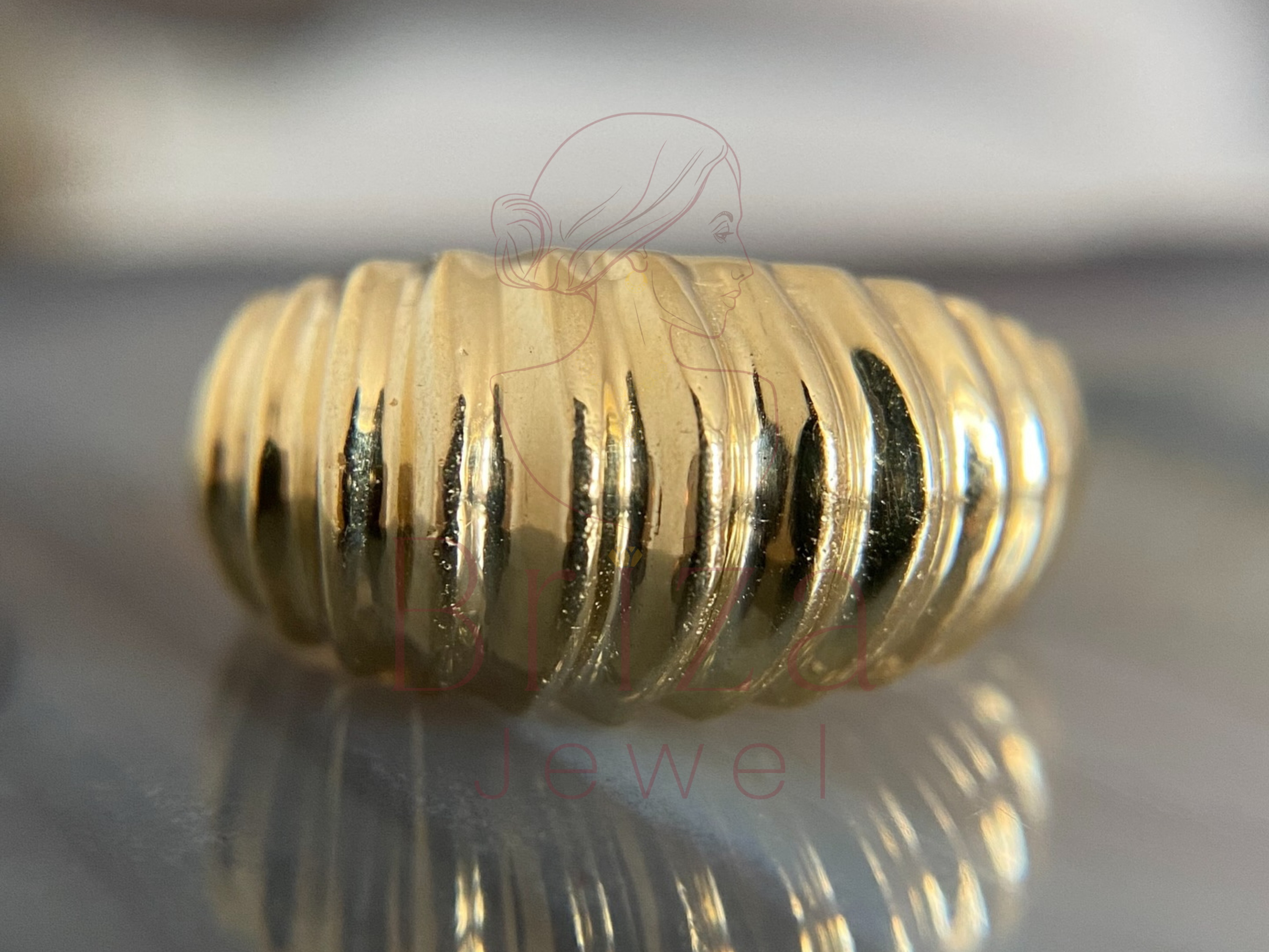 vintage engagement ring with elegant ribbed gold texture