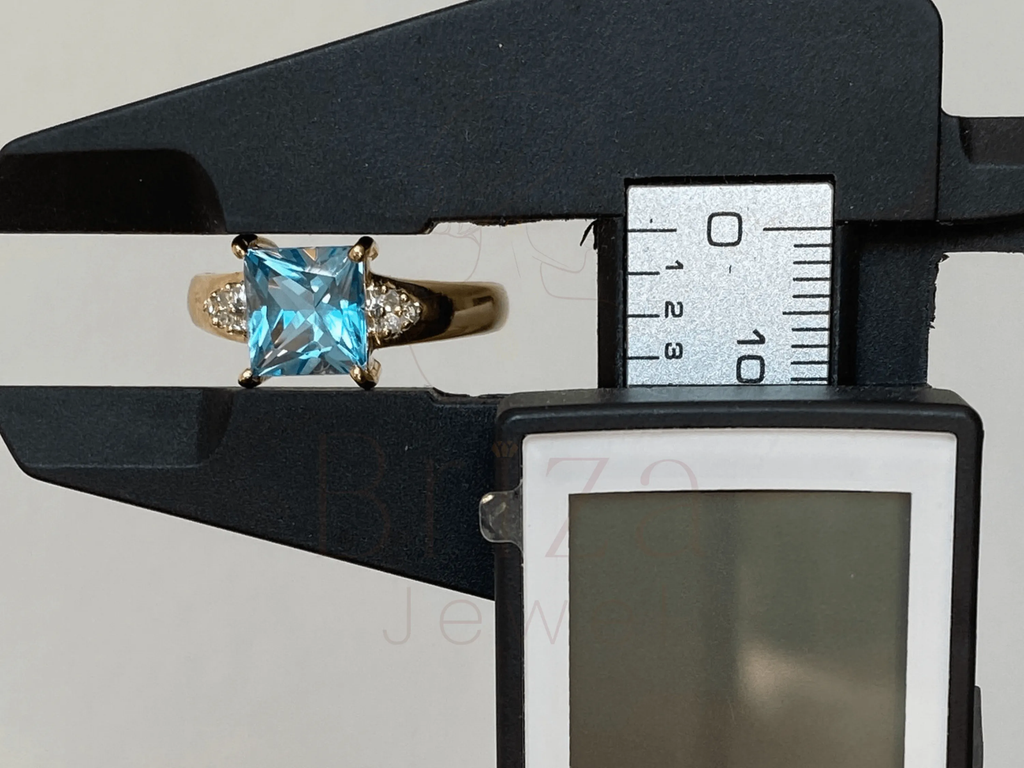 Princess Cut Blue Diamond Ring with Elegant Gold Design