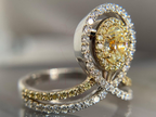 yellow center stone surrounded by halo in split shank setting