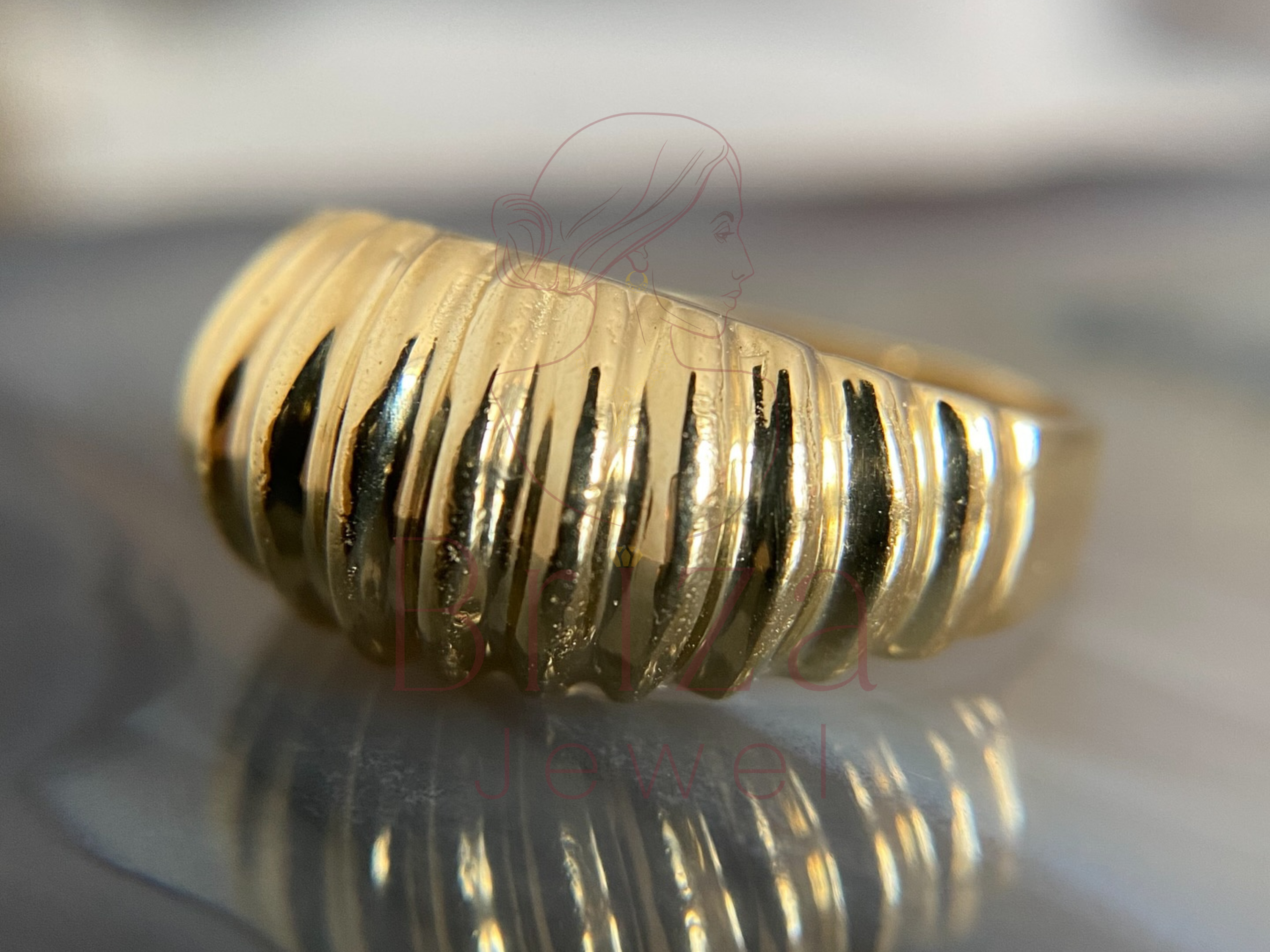 ribbed gold band with refined textured finish