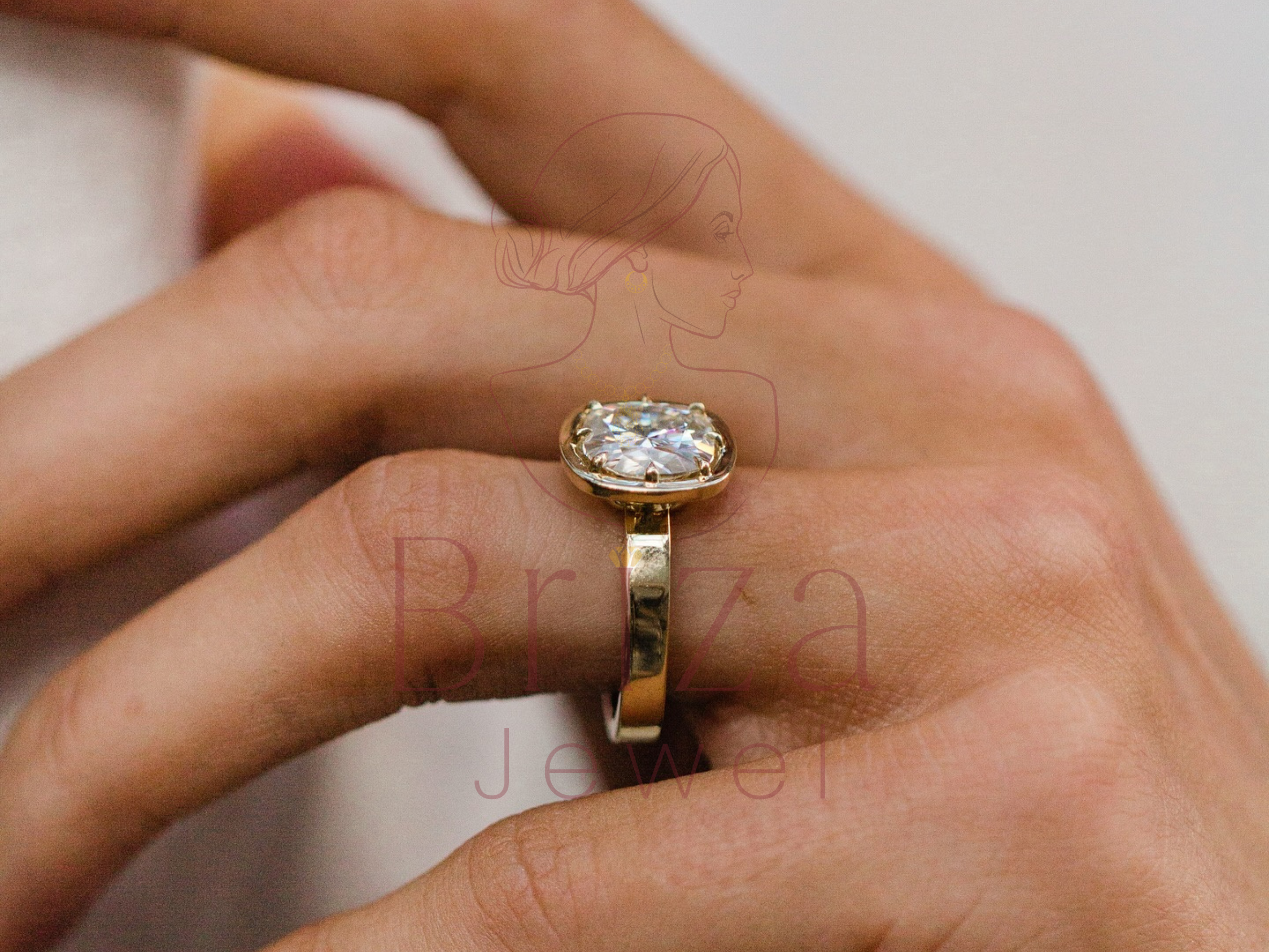 Gold ring with a diamond on a person's finger, with 'Rina' jewelry brand visible.