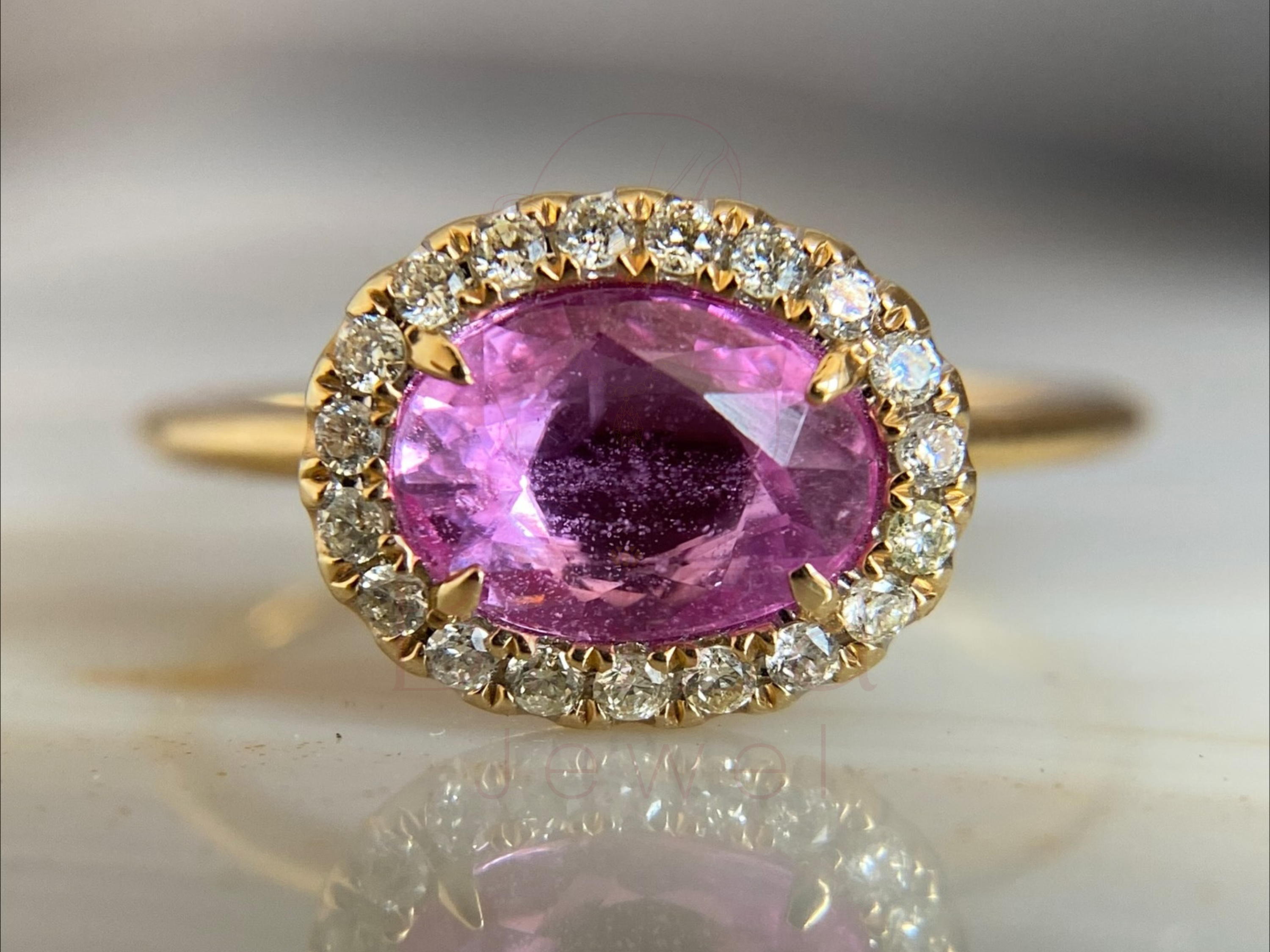 pink sapphire eternity band with diamond halo in yellow gold