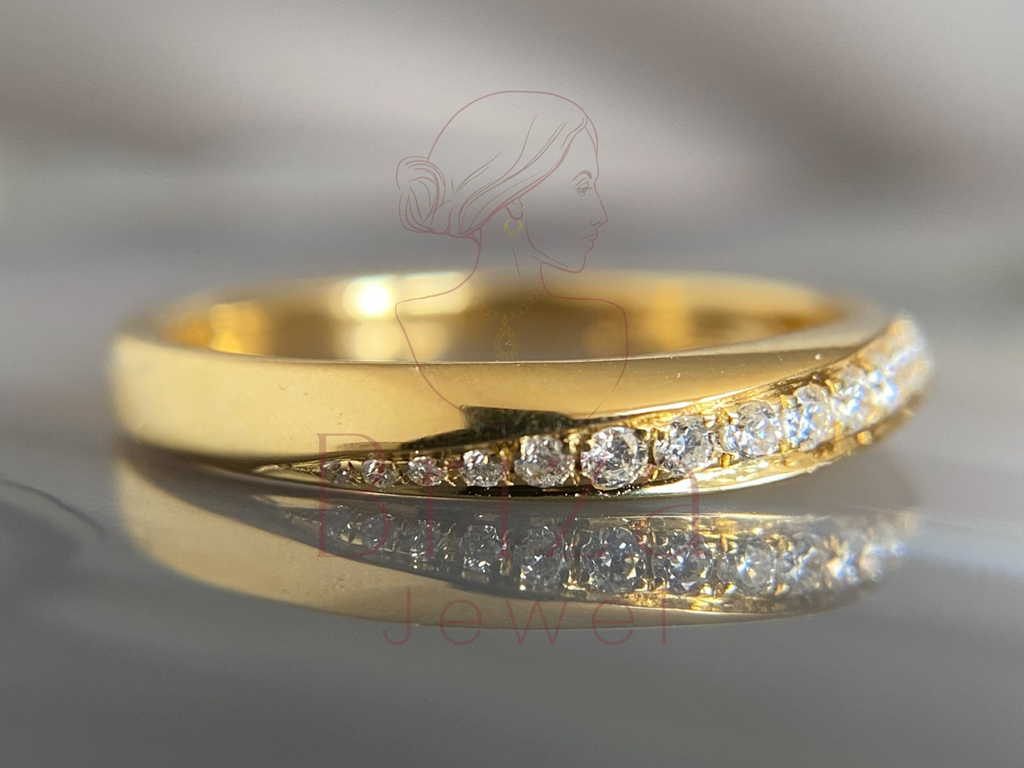 dainty gold stacking band with sparkling stone accents