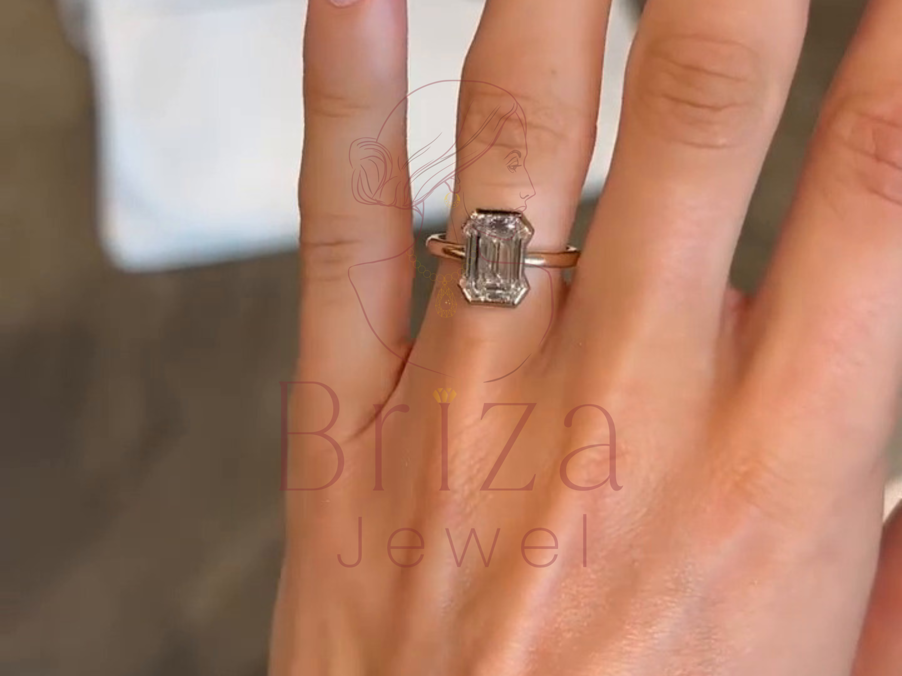 classic gold engagement ring worn on hand lifestyle view