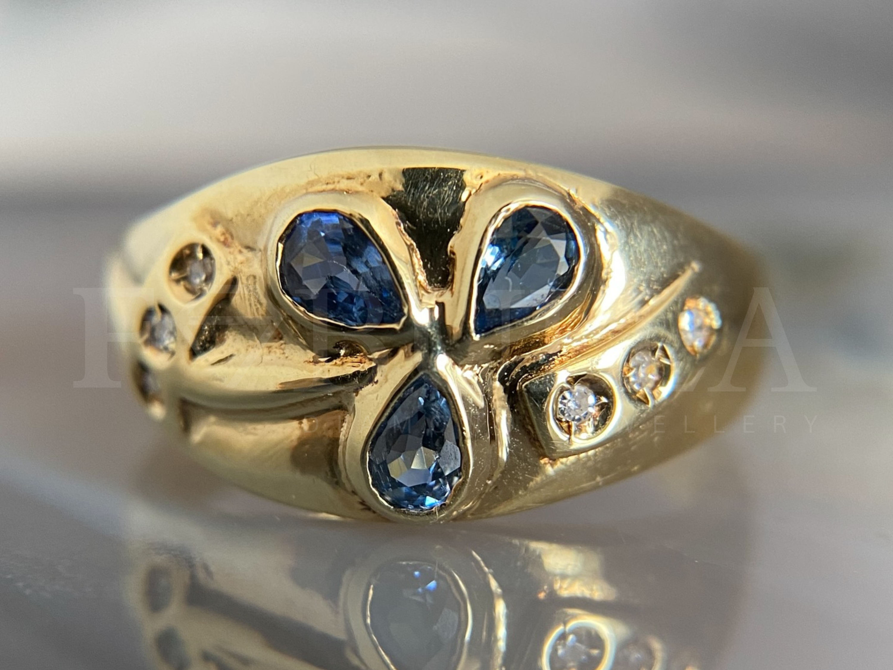 floral sapphire ring with vintage gold diamond cluster design