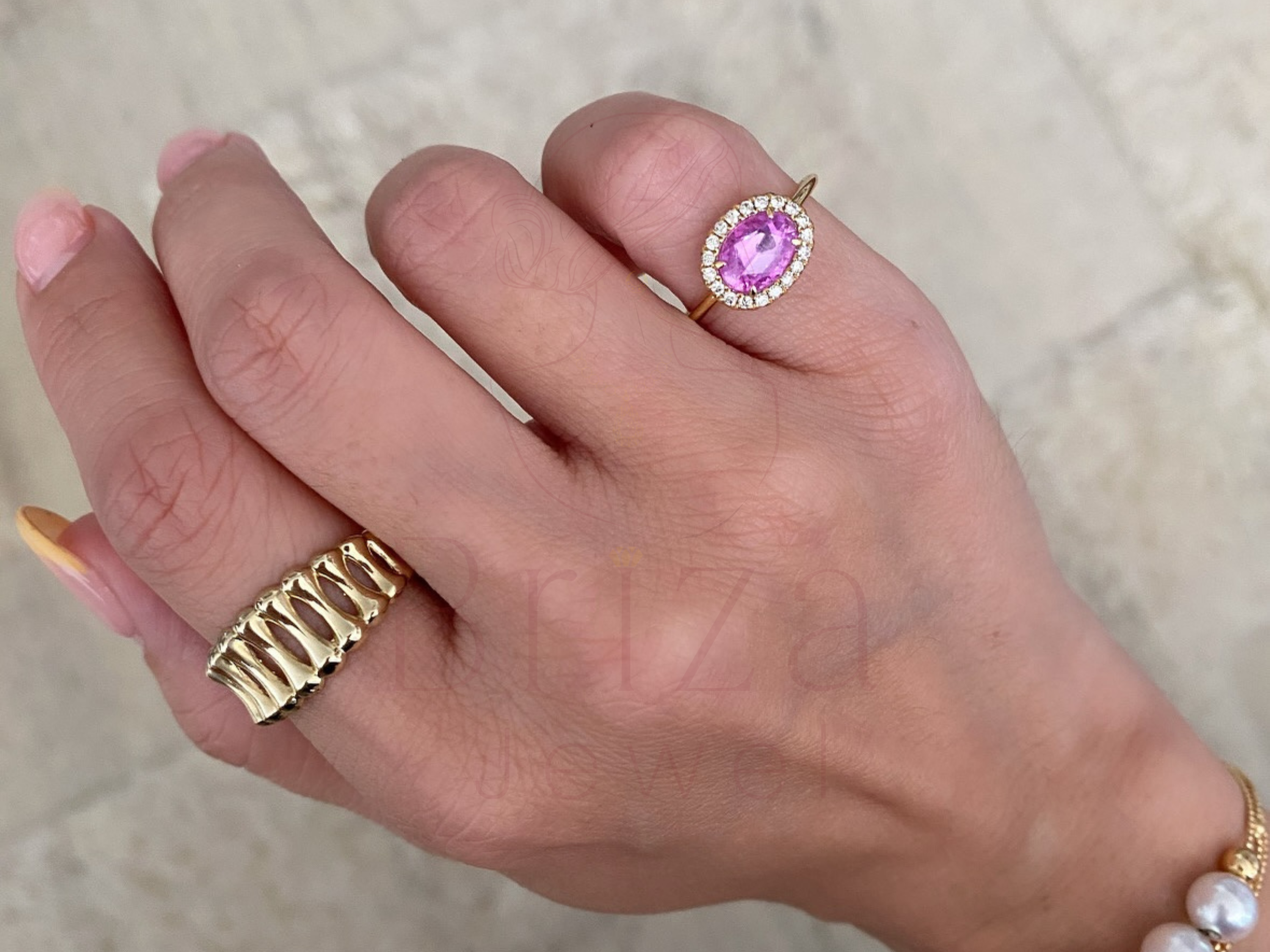 pink sapphire eternity band close-up showing halo stone detail