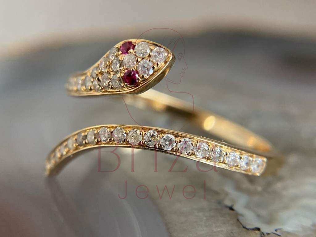 luxury snake-inspired gold ring worn on hand