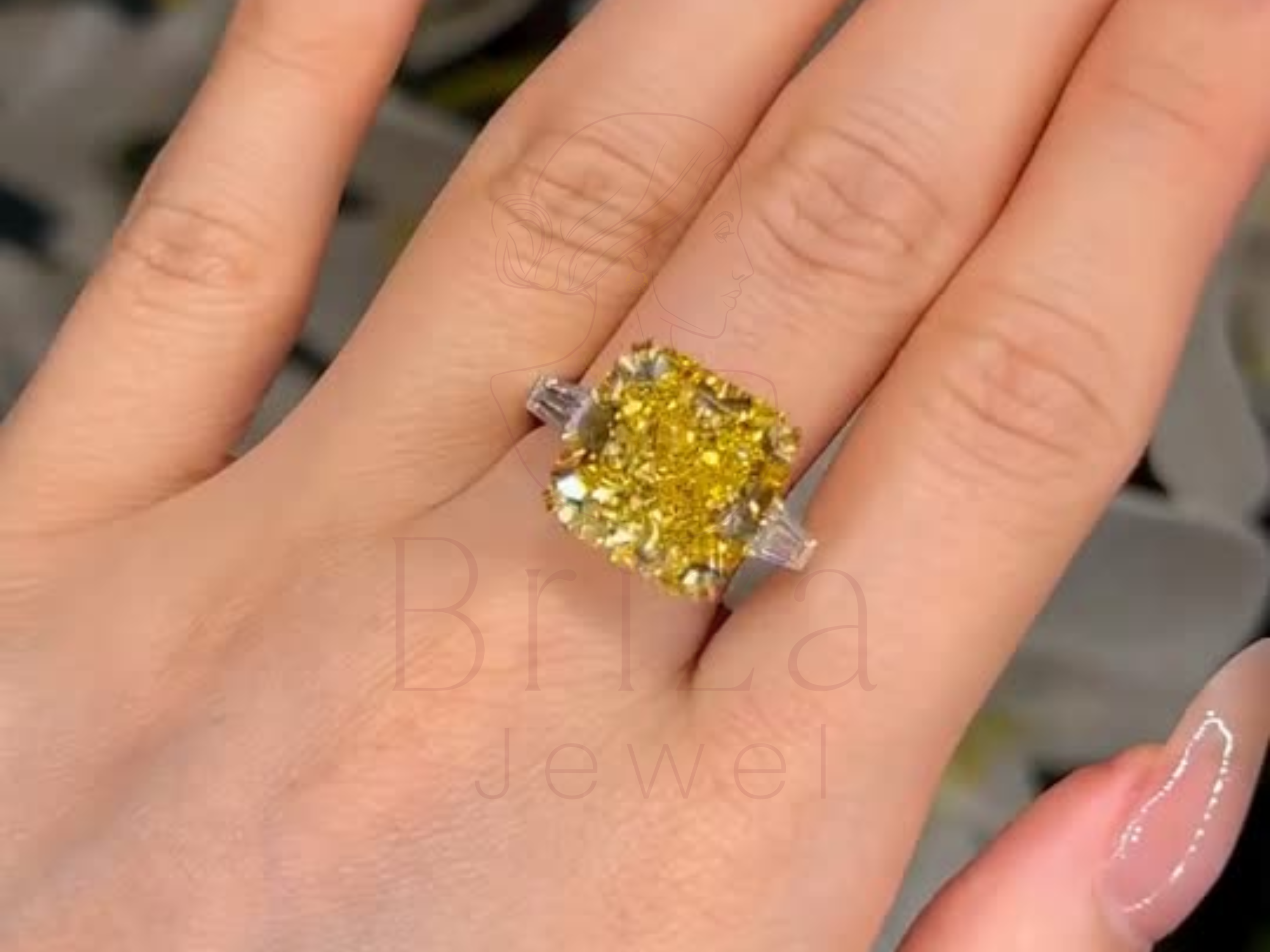 Elegant yellow diamond ring with baguette sides