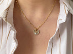 Gold diamond necklace with halo design by Briza Jewel